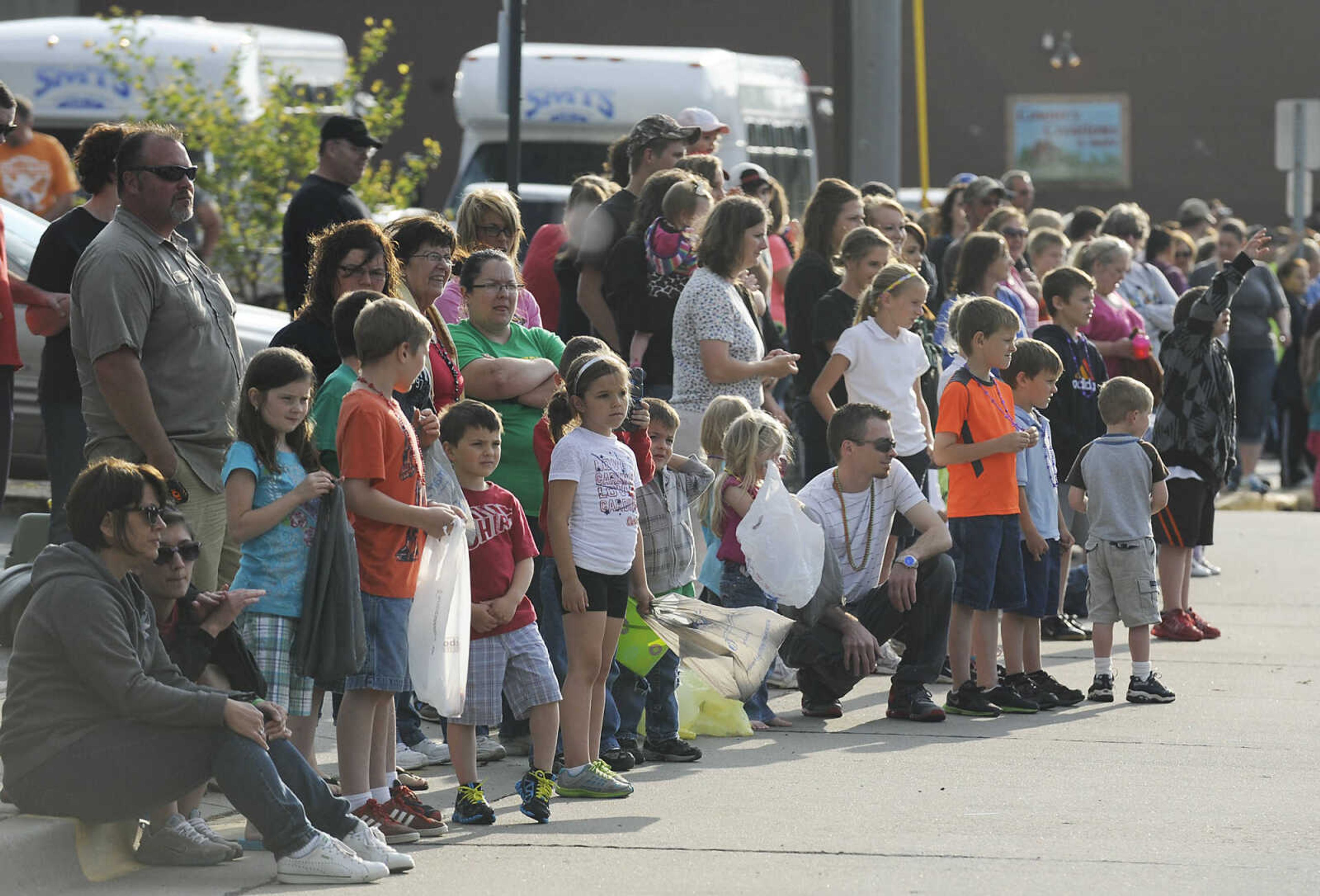 Spectators line the street during the Perryville Mayfest Parade Friday, May 10, in Perryville, Mo. This year's Mayfest theme is Peace, Love, Perryville Mayfest.