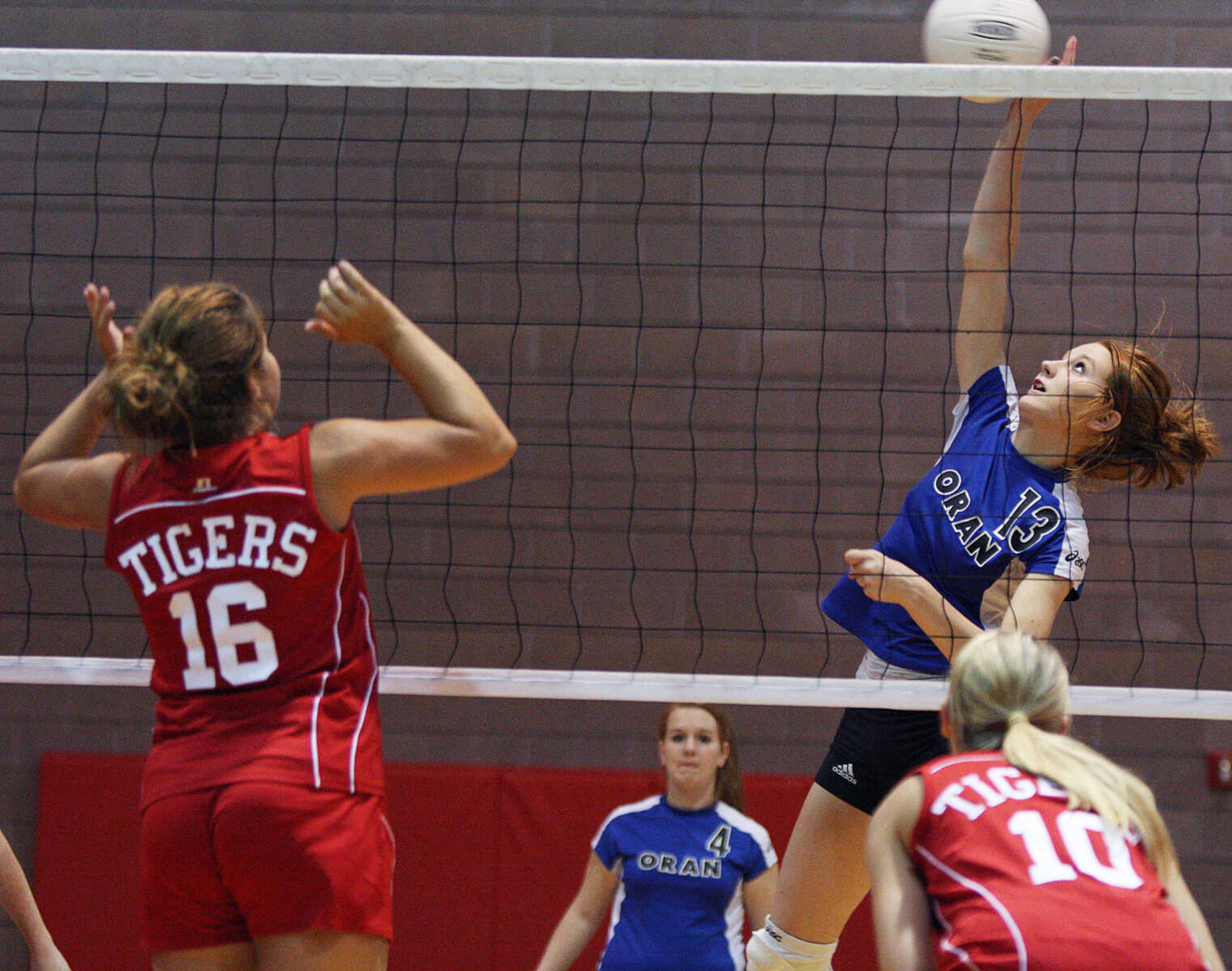 Oran's Holly Millam returns the ball against the Caruthersville Tigers.