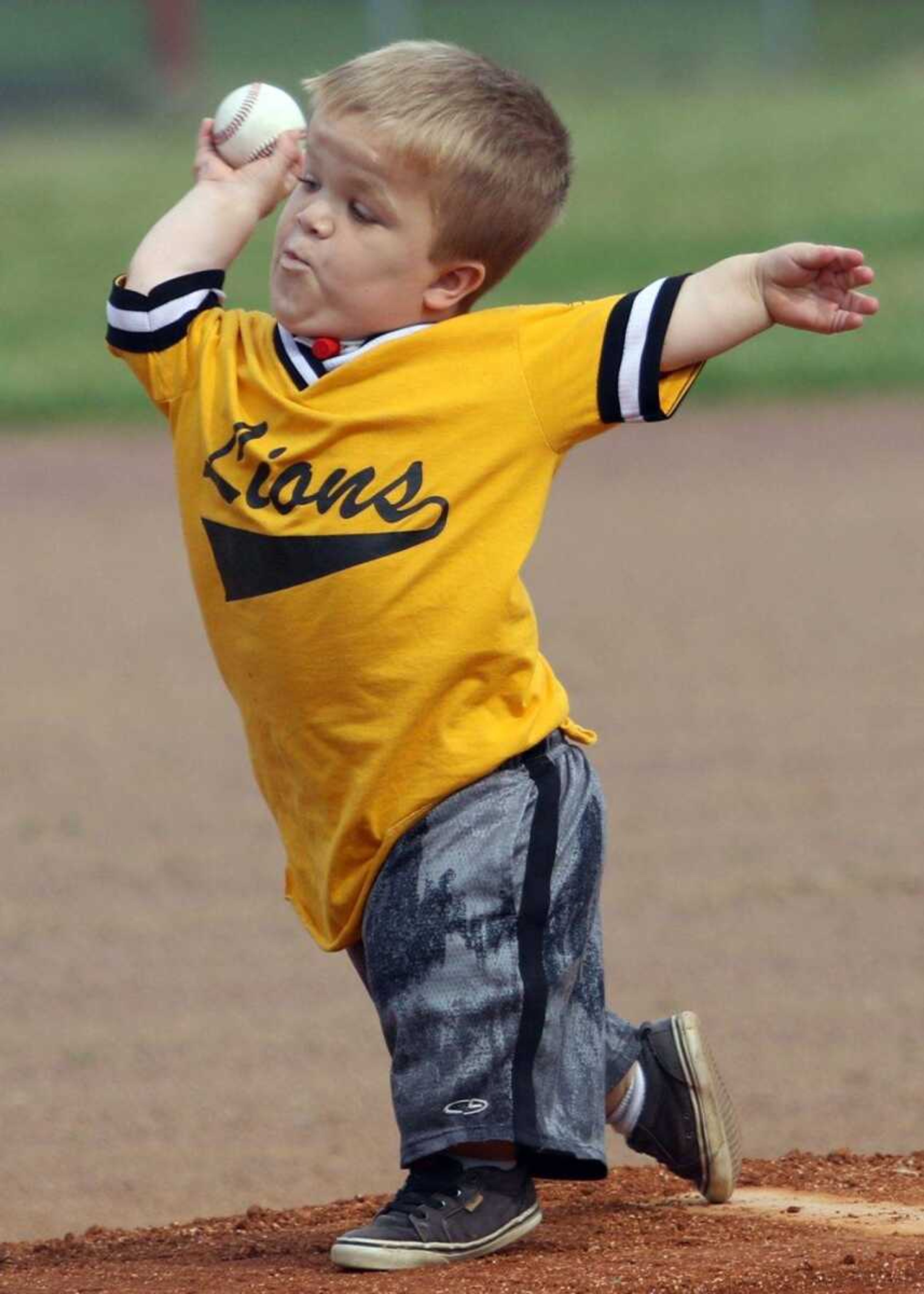 Izaac Pursley, 8, throws out the ceremonial first pitch during a Class 1 sectional Monday against Gideon in Bell City, Missouri. The Cubs met Pursley while volunteering at the Southeast Missouri Challenger Baseball event last weekend in Sikeston, Missouri.