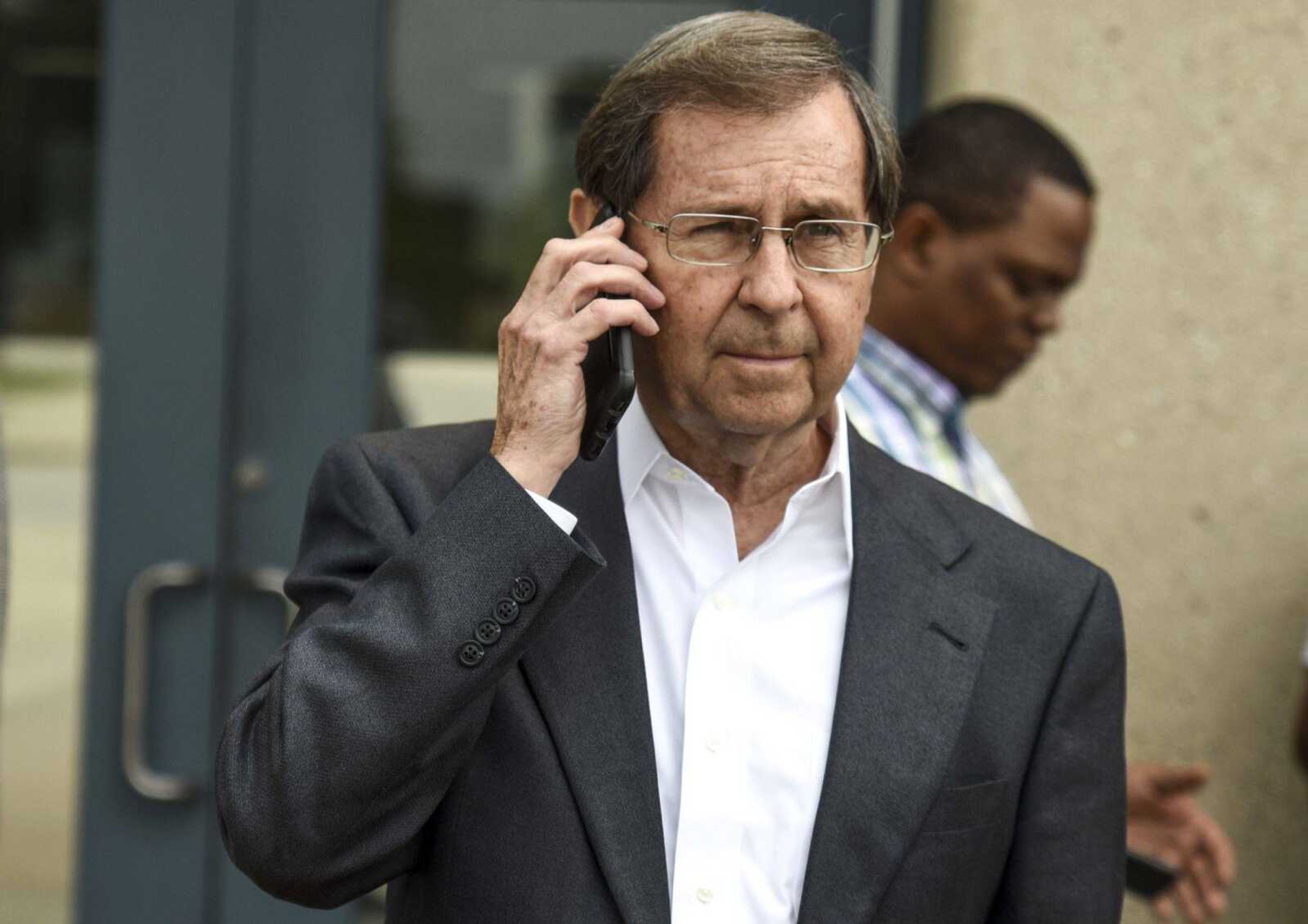 Charlie Weiss makes a phone call outside of the Jefferson City Correctional Center on Monday in Jefferson City, Missouri.