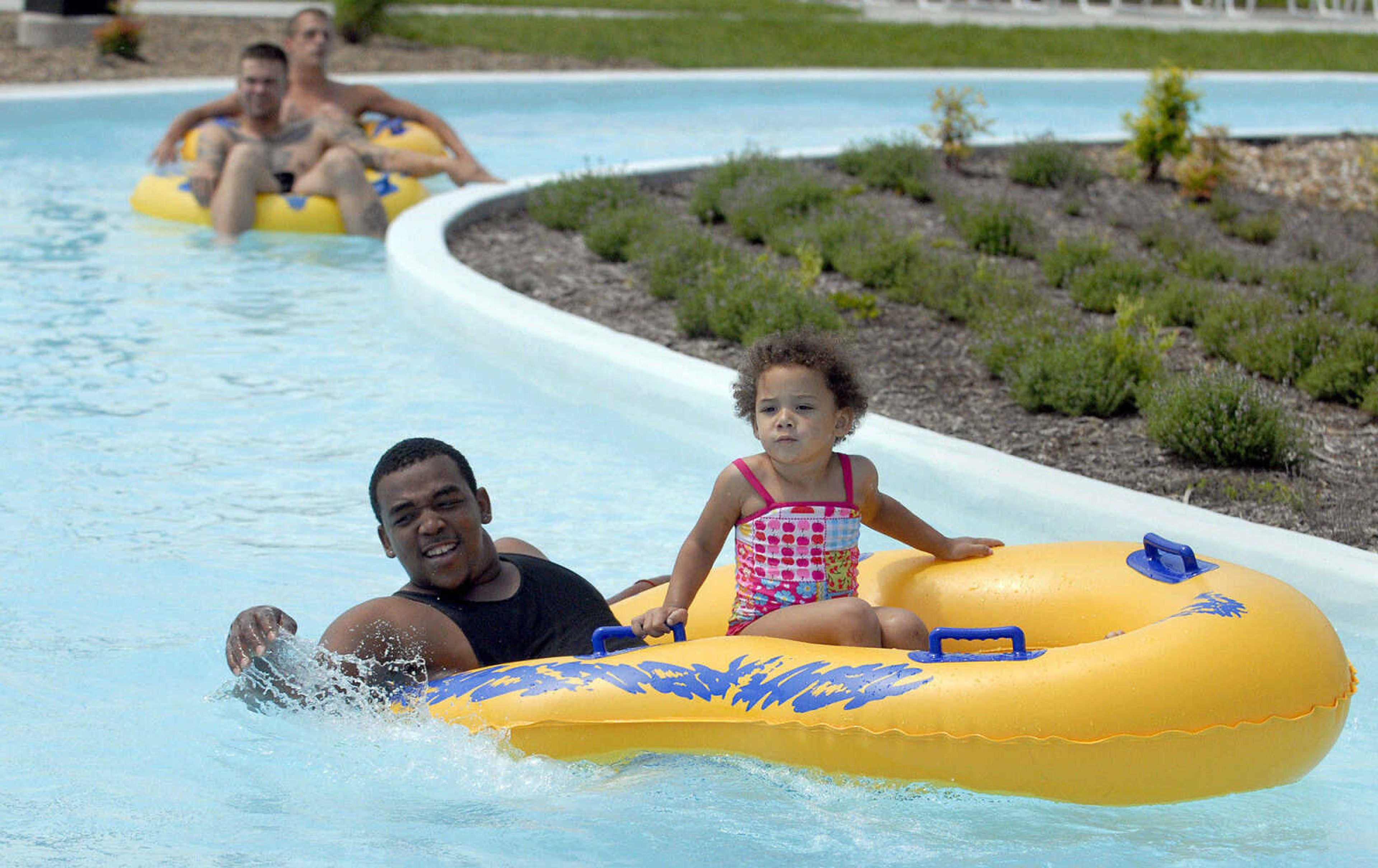 LAURA SIMON~lsimon@semissourian.com
Theon and Laiylah,3, Mackins float around the lazy river Saturday, May 28, 2011 during opening day of Cape Splash Family Aquatic Center in Cape Girardeau. A chilly morning brought a slow start for opening day. At 2 p.m. Cape Splash had 117 people come through the gates. At 10:45 Saturday, the lazy river was at 68 degrees.