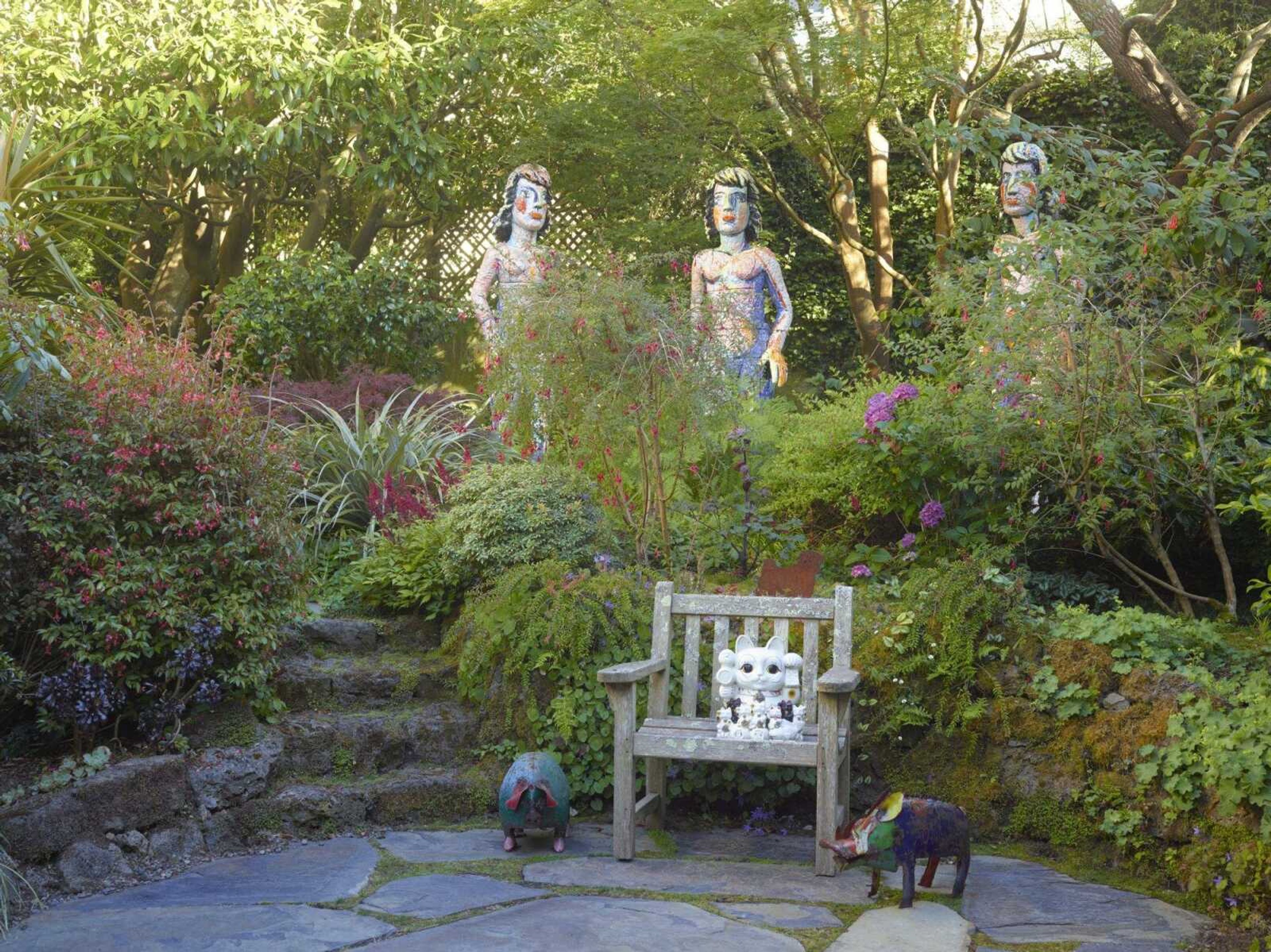 This undated photo provided by The Monacelli Press shows Viola Frey s  The Three Graces  in the Rena Bransten Garden, a private residential garden in San Francisco. The garden is featured in the book  Private Gardens of the Bay Area.  (Marion Brenner/The Monacelli Press via AP)