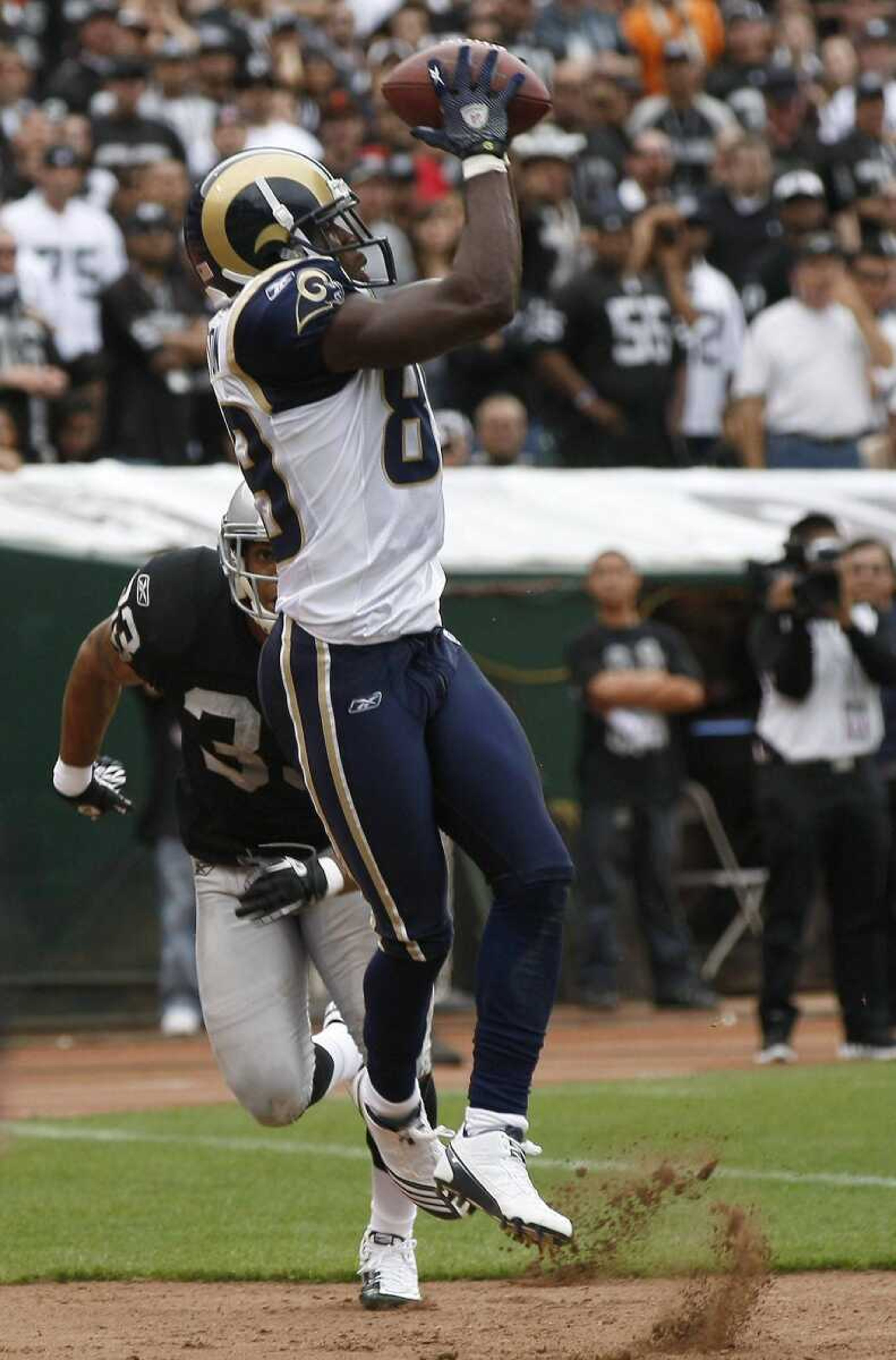 Rams receiver Mark Clayton catches a touchdown pass against the Raiders in Week 2. Clayton suffered a season-ending knee injury during Sunday's game. (Marcio Jose Sanchez ~ Associated Press)