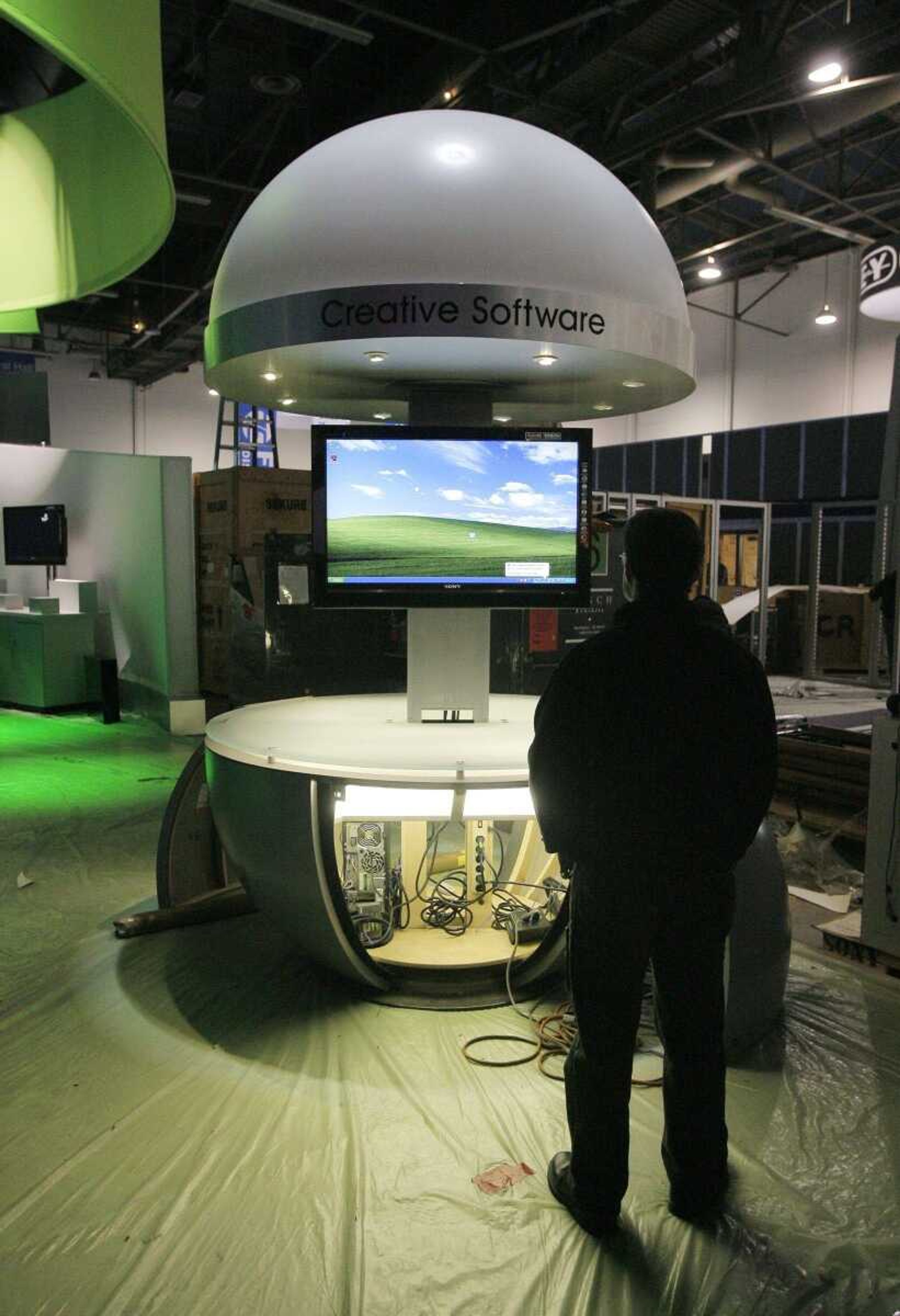 Lighting designer Israel Golubich looked at a display Thursday at the Sony booth at the Las Vegas Convention Center in Las Vegas. Exhibitors were getting ready for the opening of the Consumer Electronics Show, which starts Monday. (Jae C. Hong ~ Associated Press)