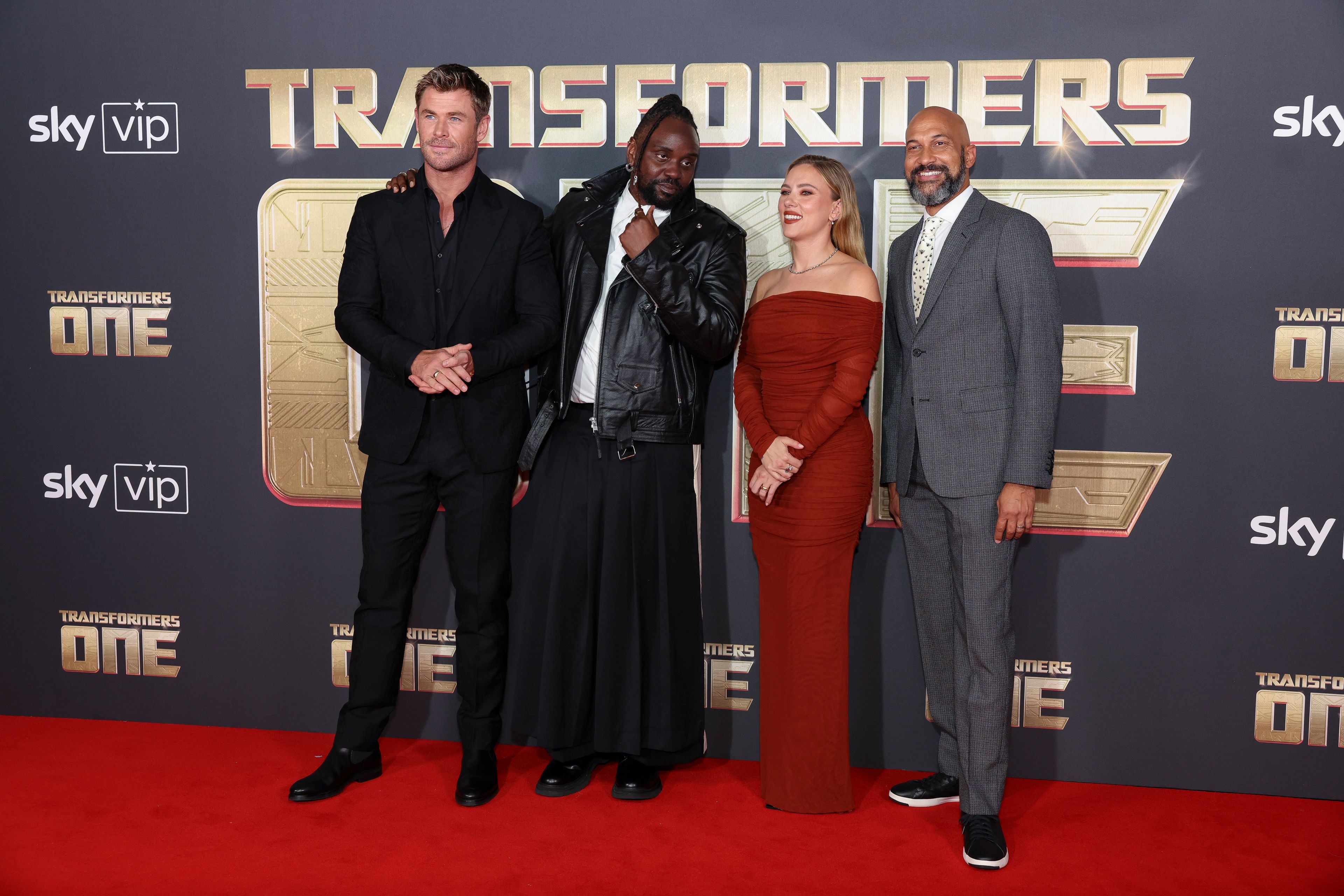 Chris Hemsworth, from left, Brian Tyree Henry, Scarlett Johansson and Keegan-Michael Key pose for photographers upon arrival at the premiere for the film 'Transformers One' on Thursday, Sept. 19, 2024 in London. (Photo by Vianney Le Caer/Invision/AP)