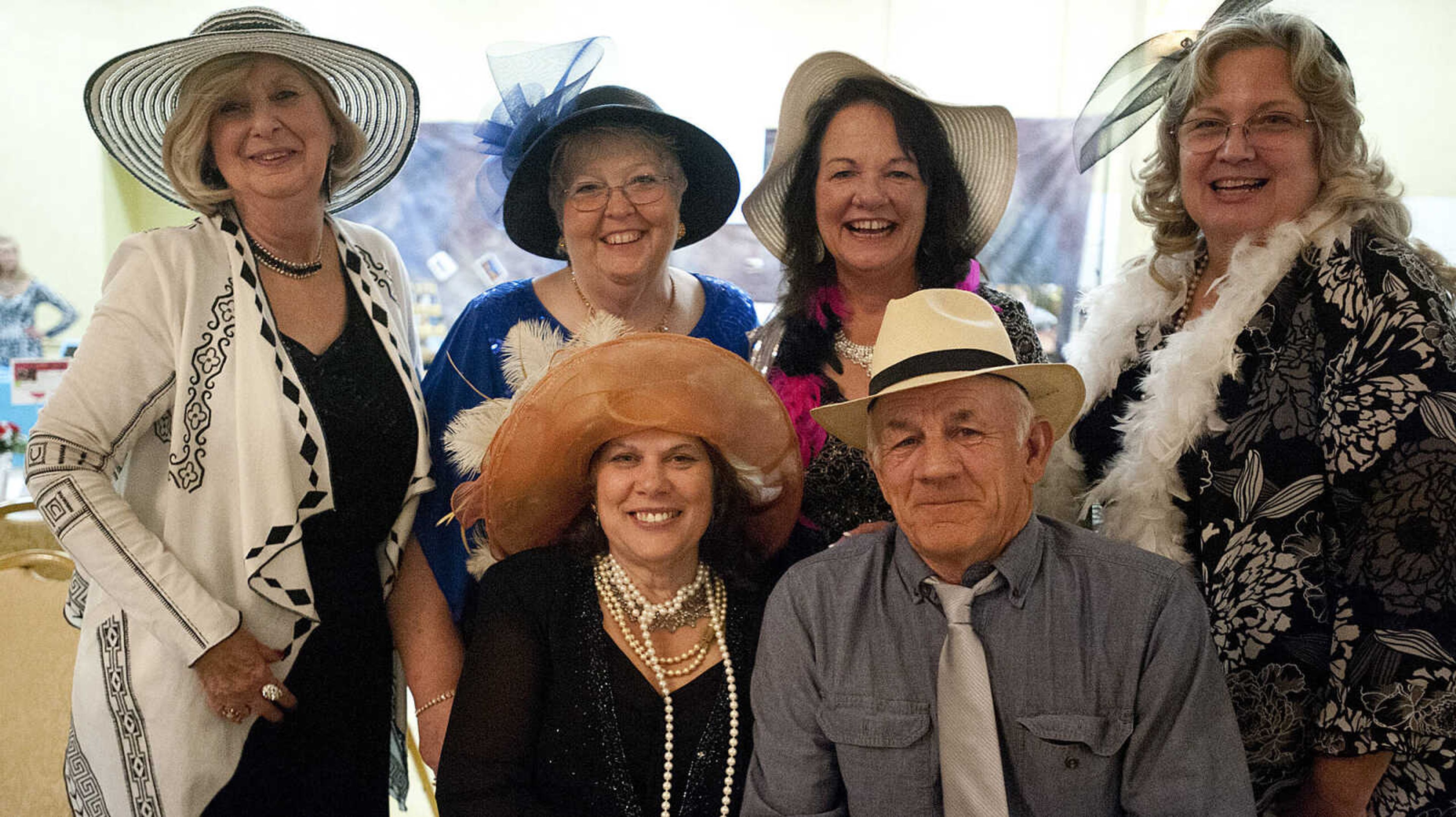 Rita Weidner, clockwise from back left, Kathy Lee, Denise Tanner, Charlie Picou and Queen of Bling Carolyn Dyce at the Lutheran Family and Children's Services Foundation's "Boas & Bling, Kentucky Derby Party," Thursday, May 1, at The Venue in Cape Girardeau.