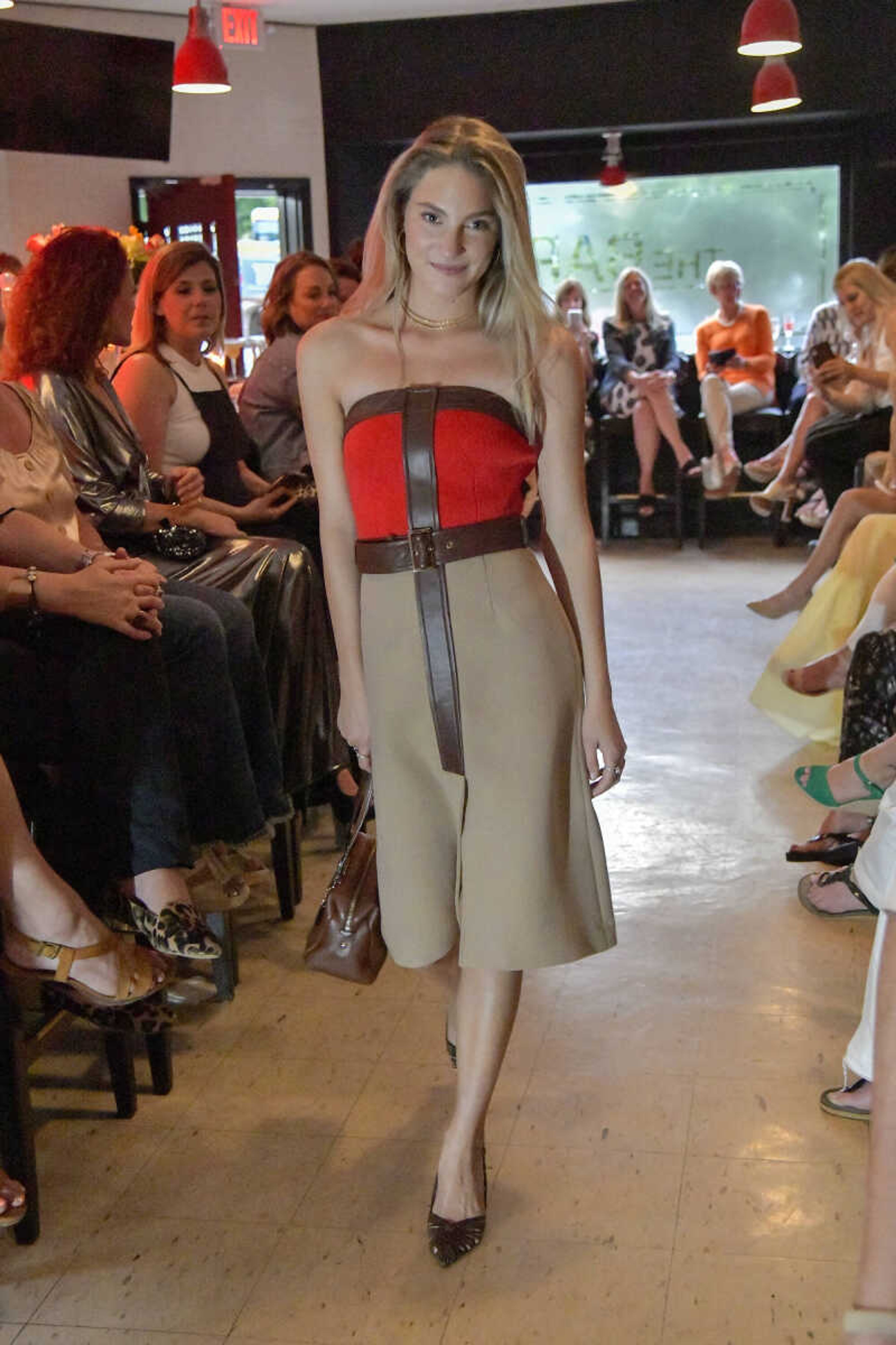 Minna Straus models a sophisticated day wear outfit during the Aesthete Luxury Resale fashion show at Le Bistro at The Bar in Cape Girardeau on Tuesday, June 8, 2021.