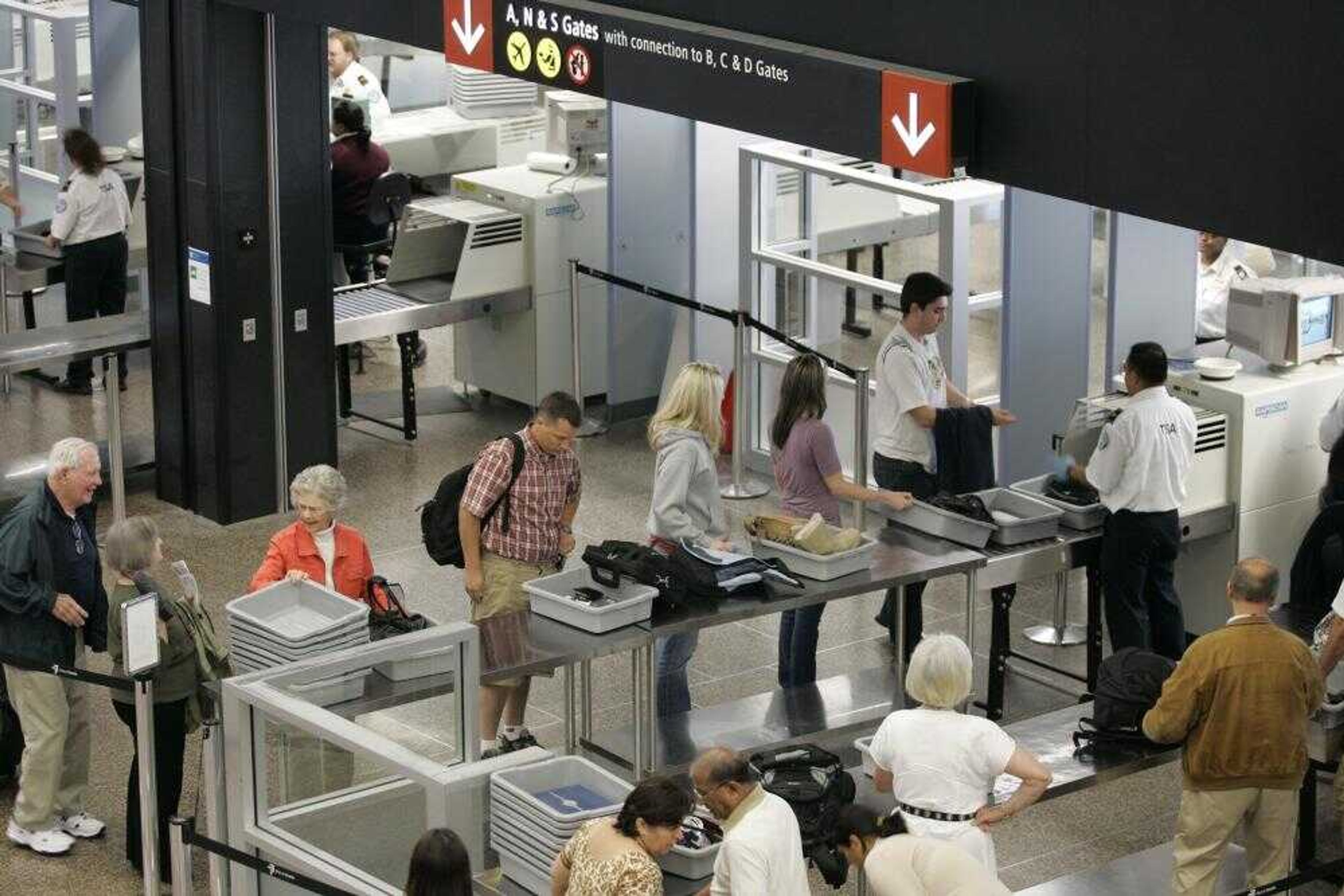 Passengers lined up for security screening May 31 at Seattle-Tacoma International Airport in Seattle. (TED S. WARREN ~ Associated Press)