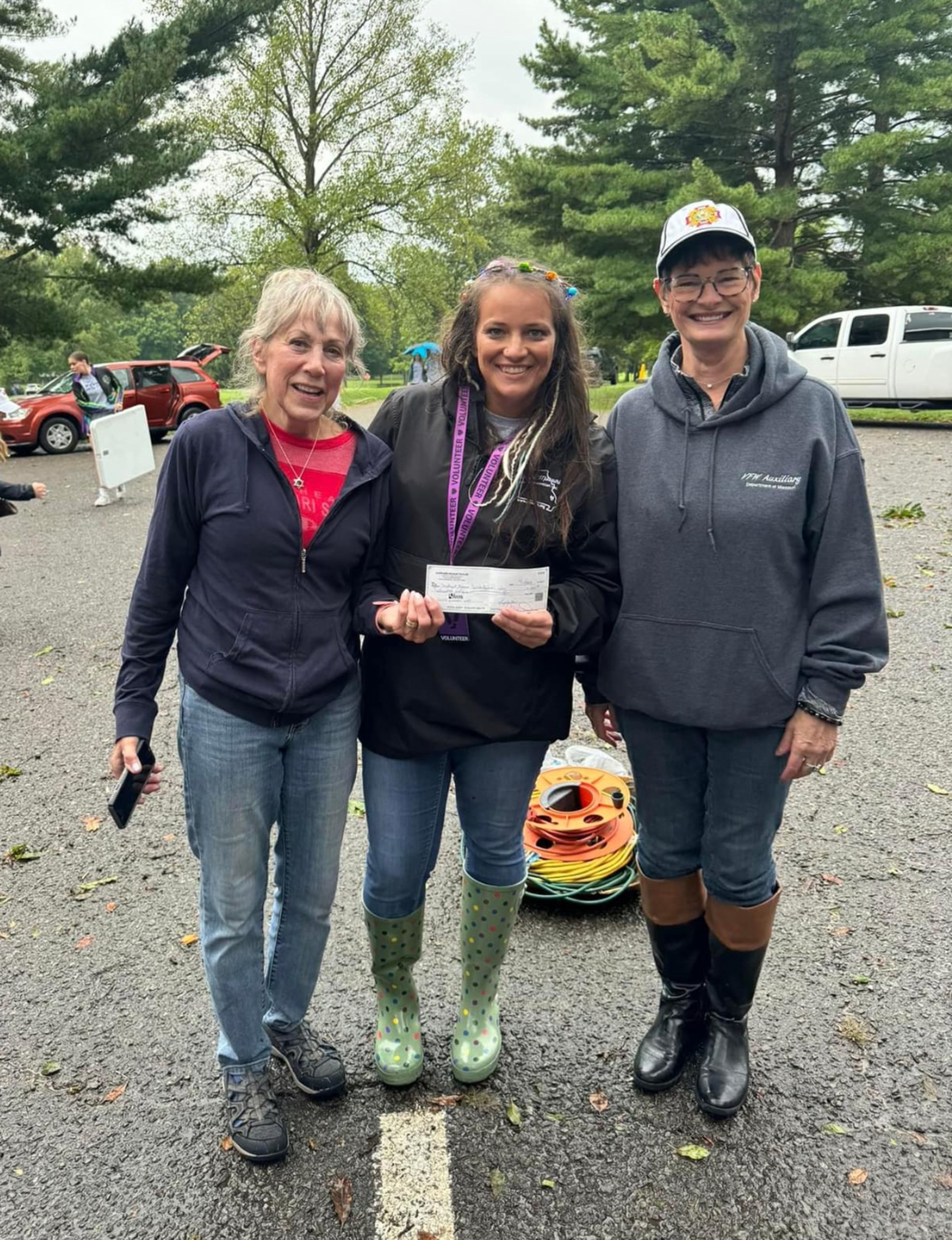 VFW Members Dale Humphries and Pam Wheeler presenting check to SEMO Suicide President Amber Berry.