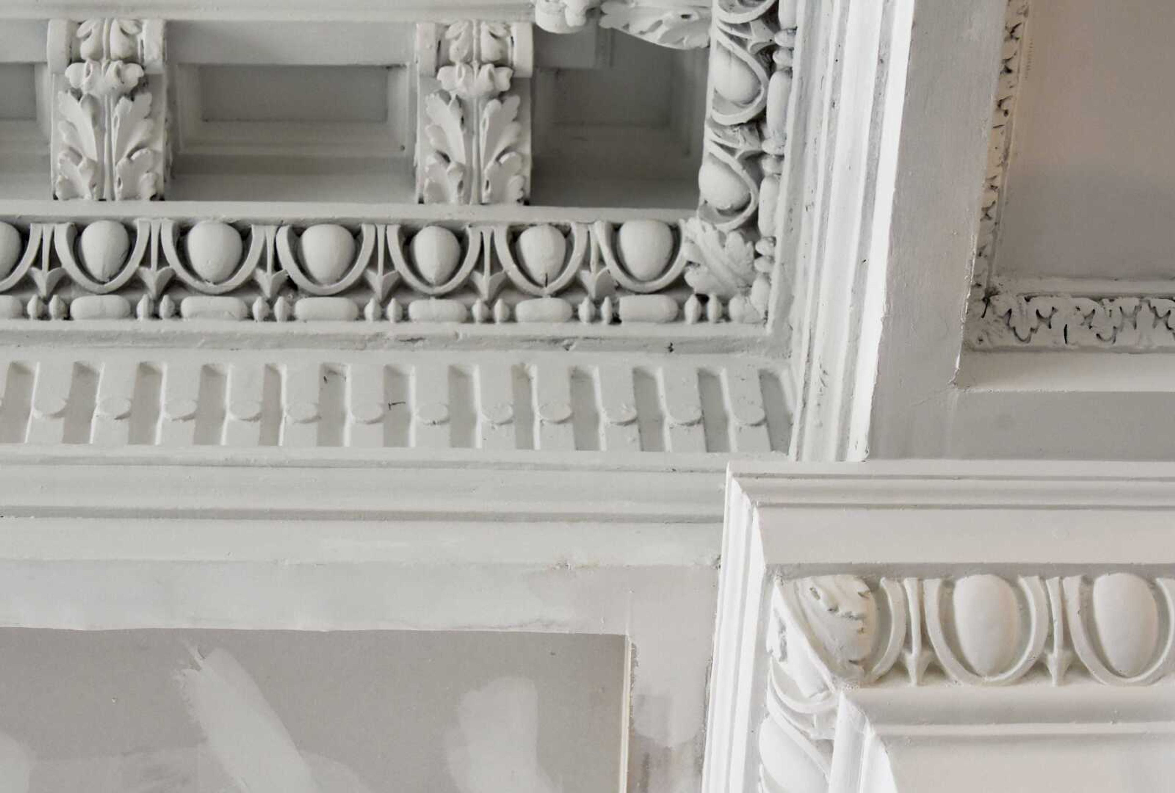 Restored ornamental designs are seen in plaster along the ceilings of the lobby in the former H-H Building on Wednesday in Cape Girardeau.