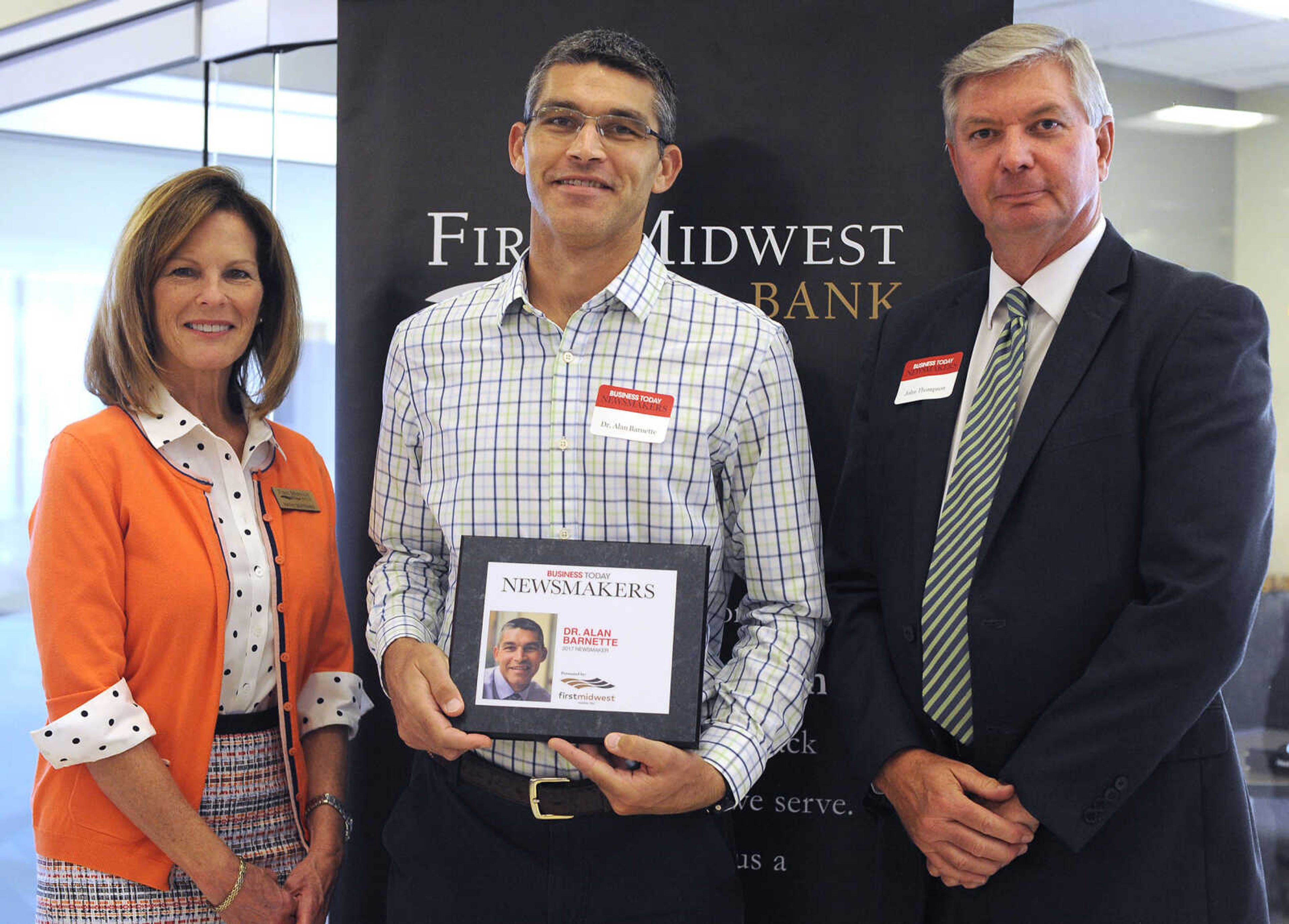 FRED LYNCH ~ flynch@semissourian.com
Dr. Alan Barnette poses for a photo with Kathy Bertrand, First Midwest Bank community bank president, Cape Girardeau, and John N. Thompson, First Midwest Bank community bank president, Jackson, Wednesday, Sept. 6, 2017 during the Business Today Newsmakers awards reception at First Midwest Bank in Cape Girardeau.