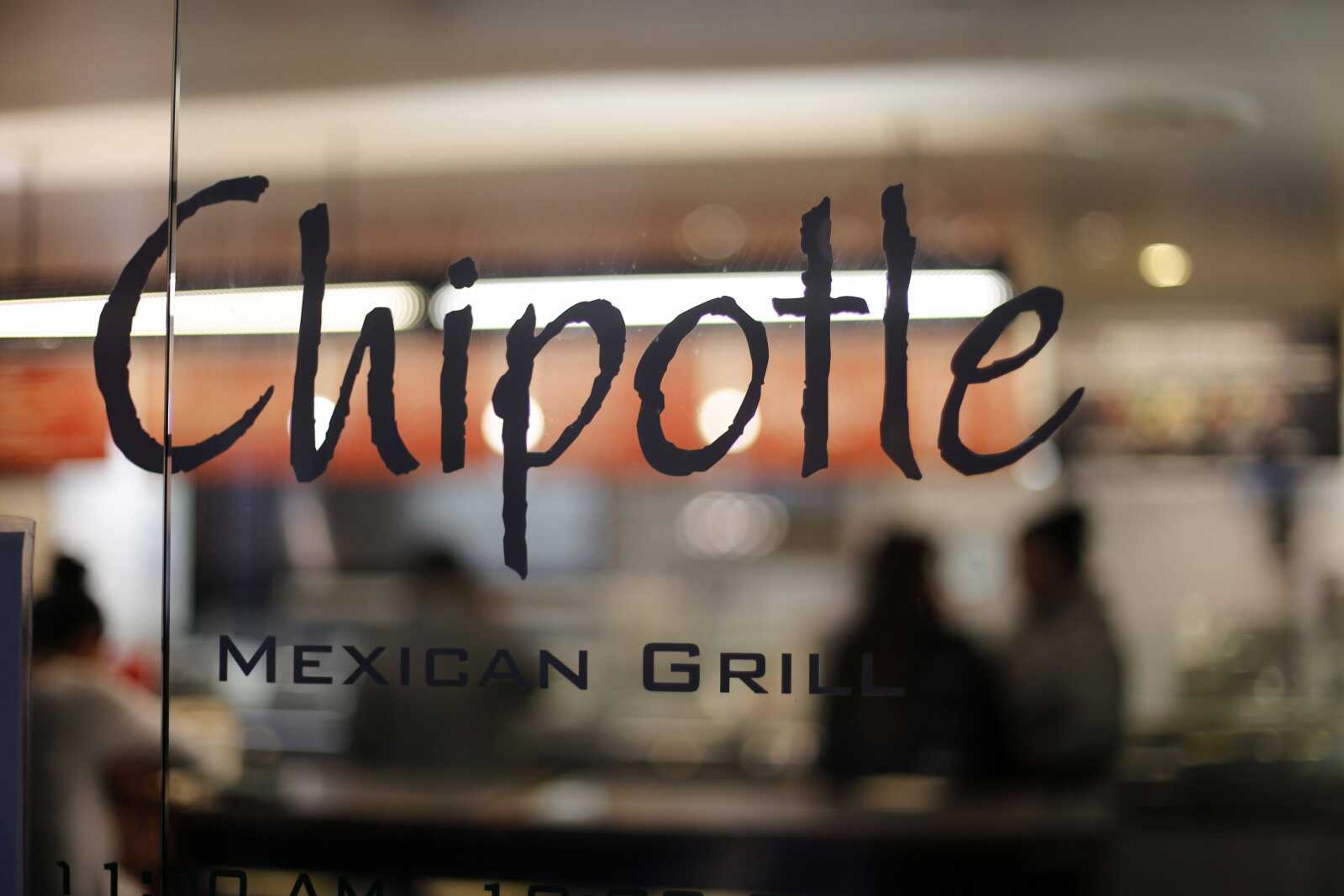 A Chipotle restaurant is shown at Union Station in Washington. Chipotle said Wednesday, it has been served with a federal grand jury subpoena as part of a criminal investigation tied to a norovirus outbreak this summer at one of its restaurants in California. (Gene J. Puskar ~ Associated Press)