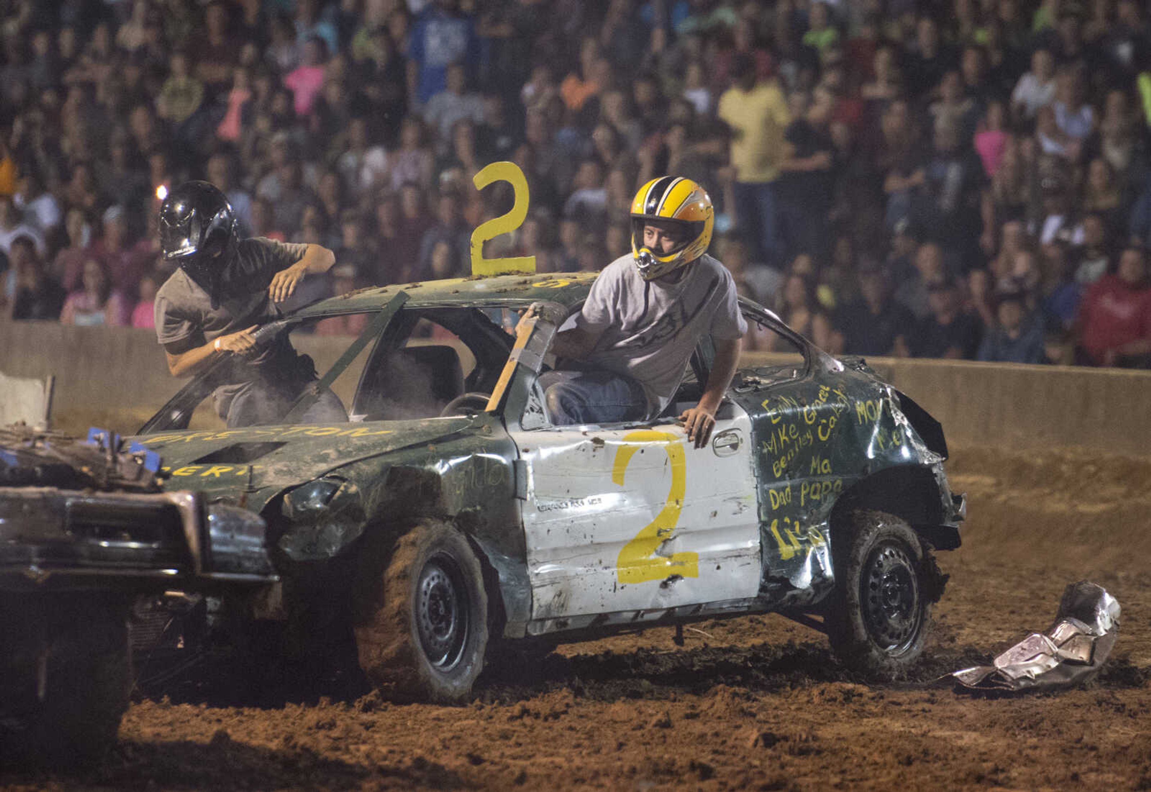 Shawn Amos exits his car after driving in the Auto Tire & Parts Dual Demo Derby September 9, 2017, at the SEMO District Fair in Cape Girardeau.