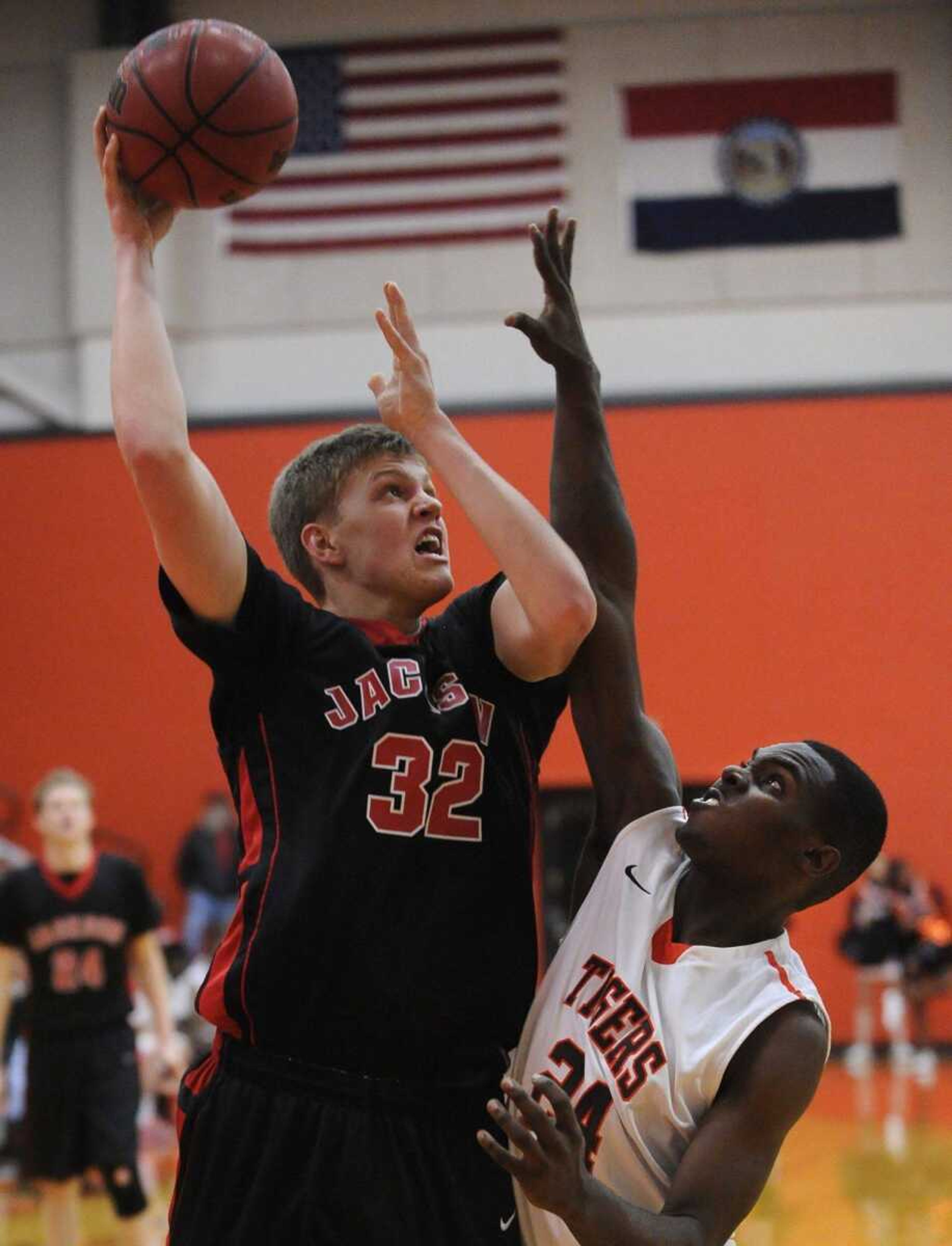 Jackson's Blake Reynolds shoots over Central's Mikey Jones during the third quarter Tuesday, Feb. 11, 2014 at Central High School. (Fred Lynch)