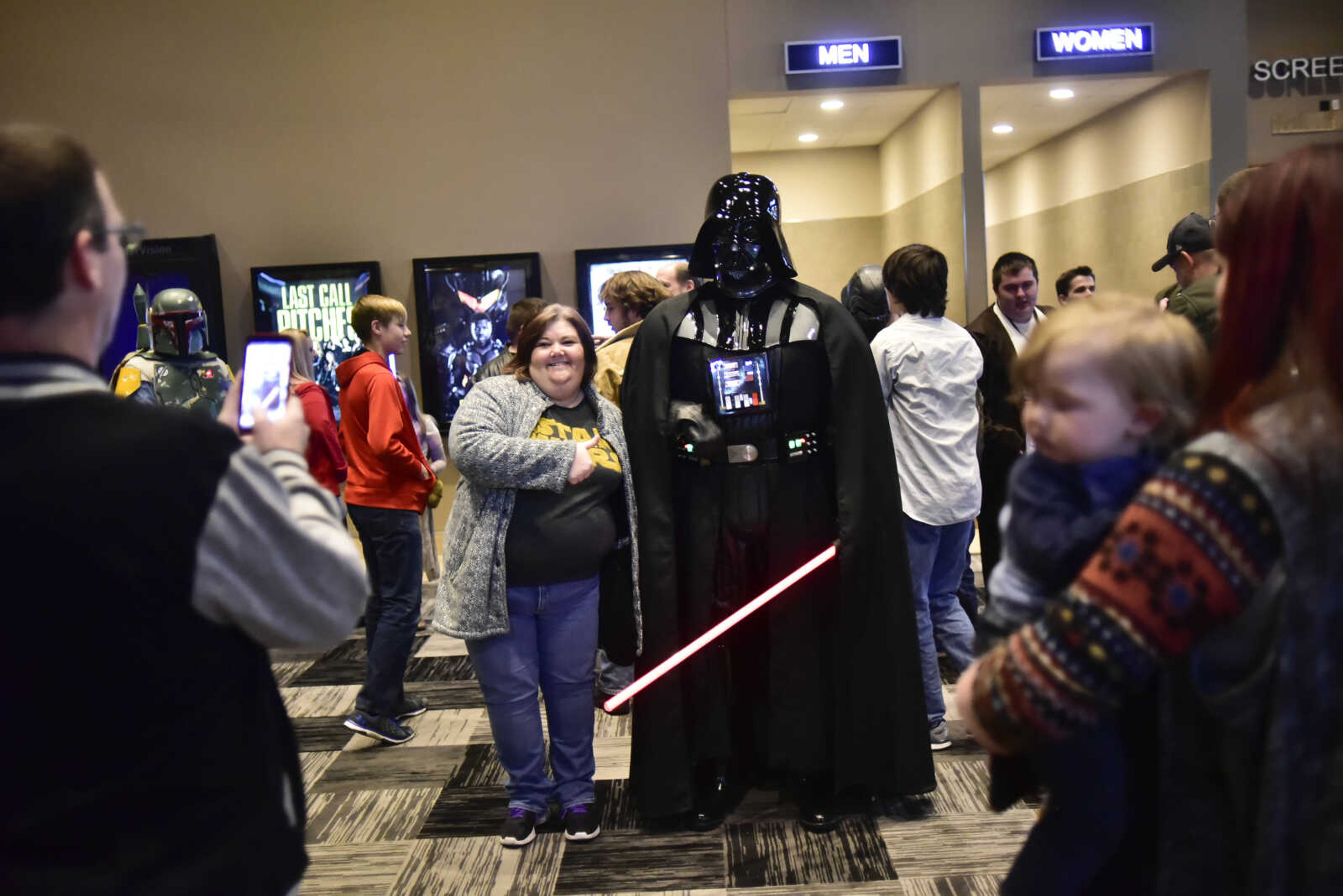 People take pictures with characters from Star Wars before the showing of Star Wars: The Last Jedi Thursday, Dec. 14, 2017 at Cape West Cinema in Cape Girardeau.