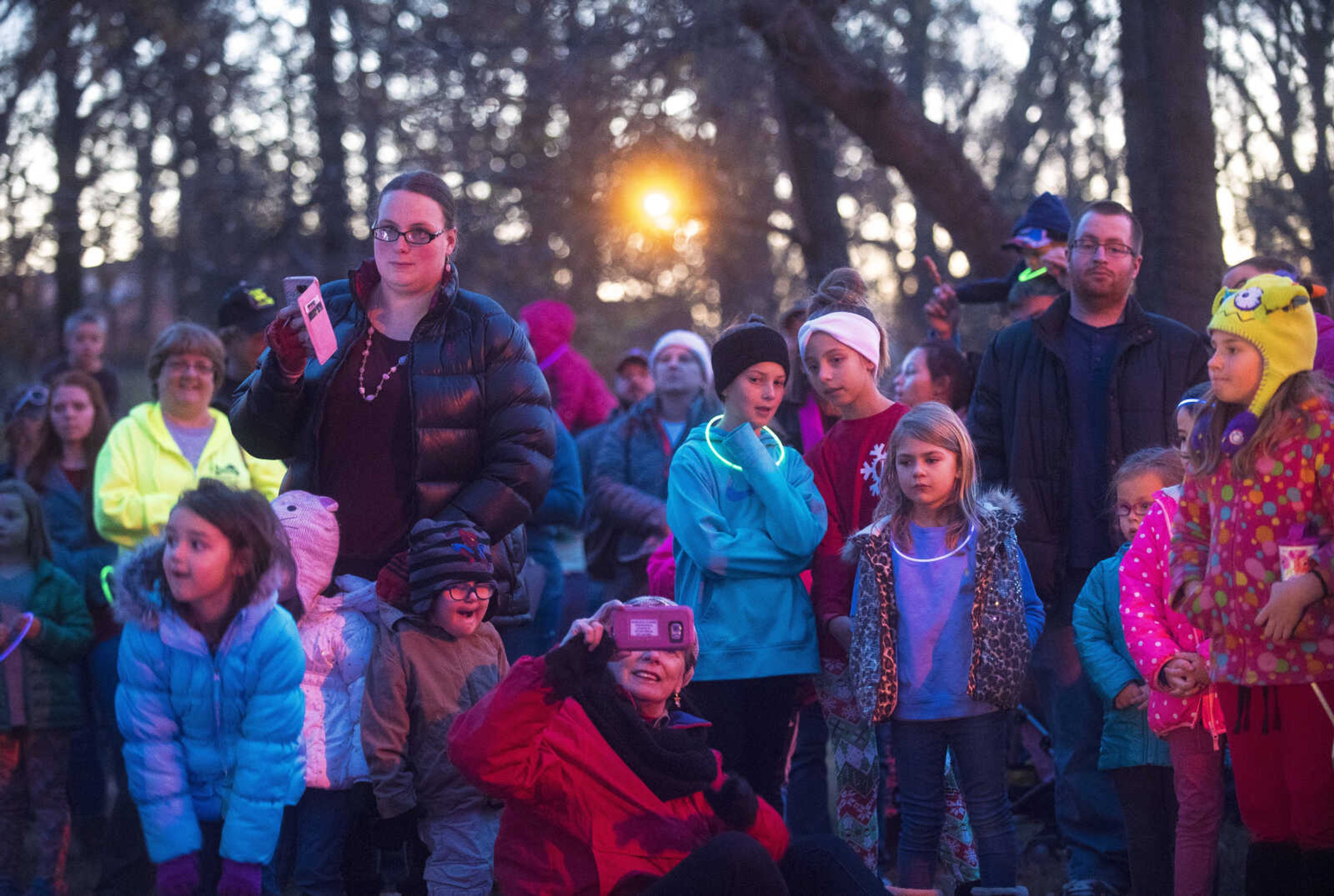 People wait for the lights to be turned on during the Jackson Holiday Extravaganza Friday, Nov. 24, 2017 at the Jackson City Park.