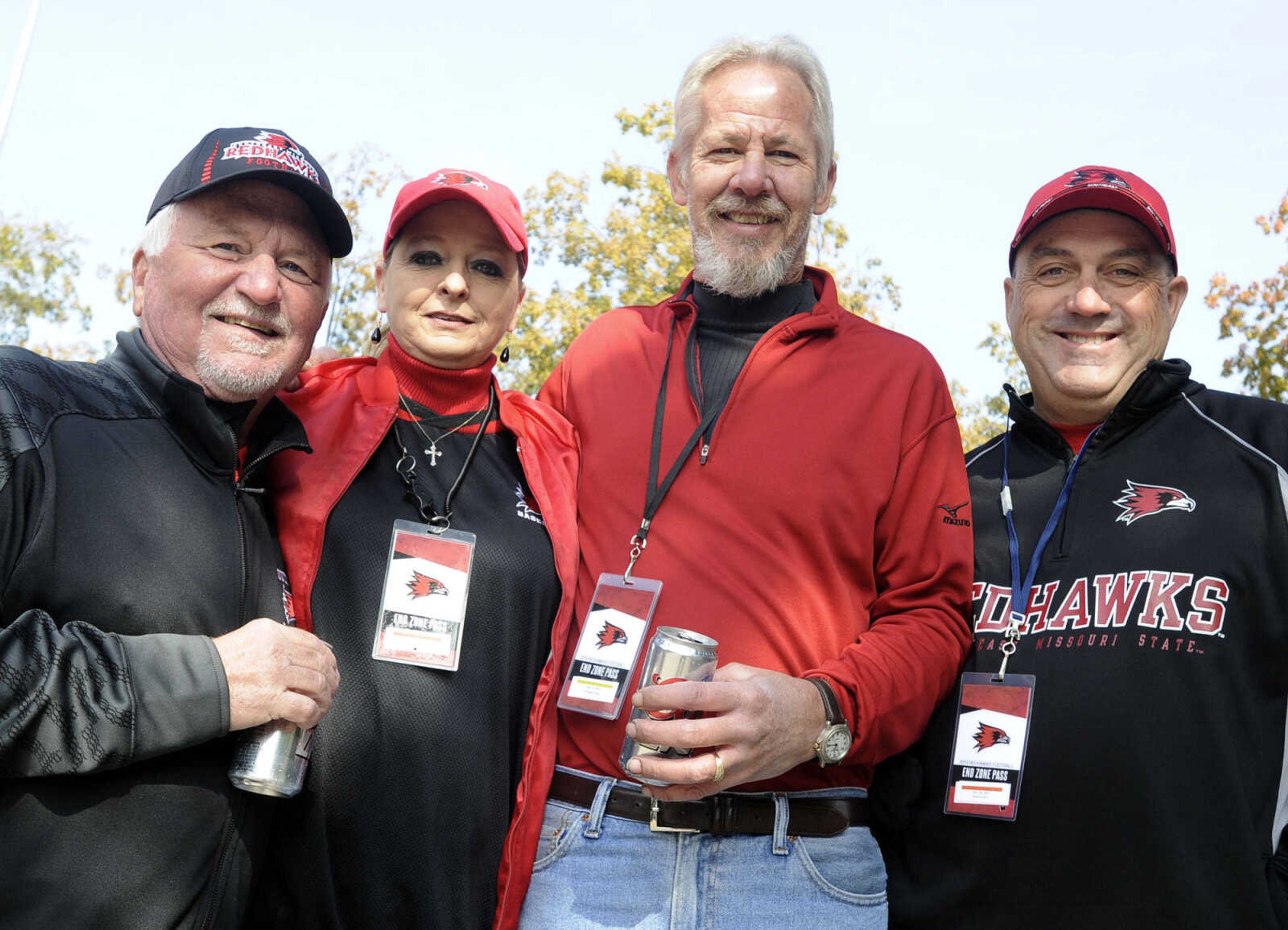 Bill Gosche, left, Lori Malvitz, Tim Maevers and Bob Kinder pose at a tailgate before the SEMO Homecoming game Saturday, Oct. 26, 2013 in Cape Girardeau.