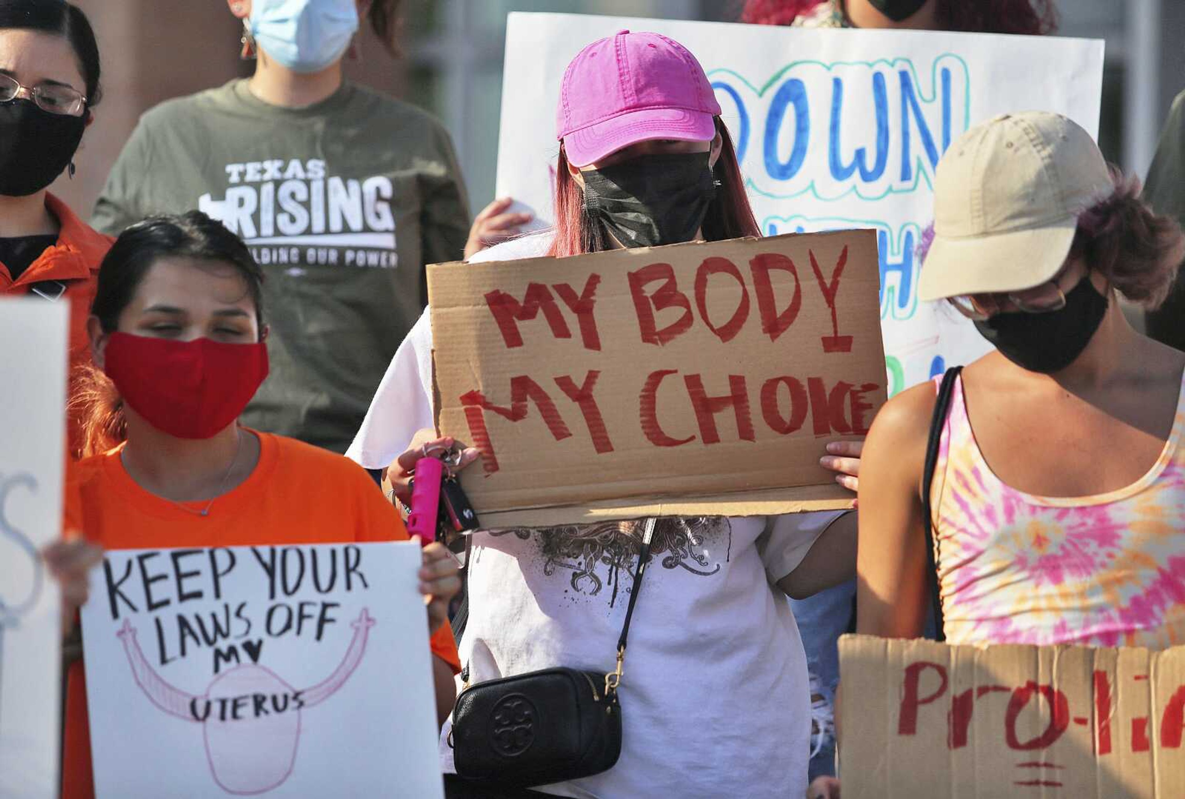 Abortion rights supporters gather to protest Texas SB8 in front of Edinburg City Hall on Wednesday in Edinburg, Texas. The nation's most far-reaching curb on abortions since they were legalized a half-century ago took effect Wednesday in Texas, with the Supreme Court silent on an emergency appeal to put the law on hold.