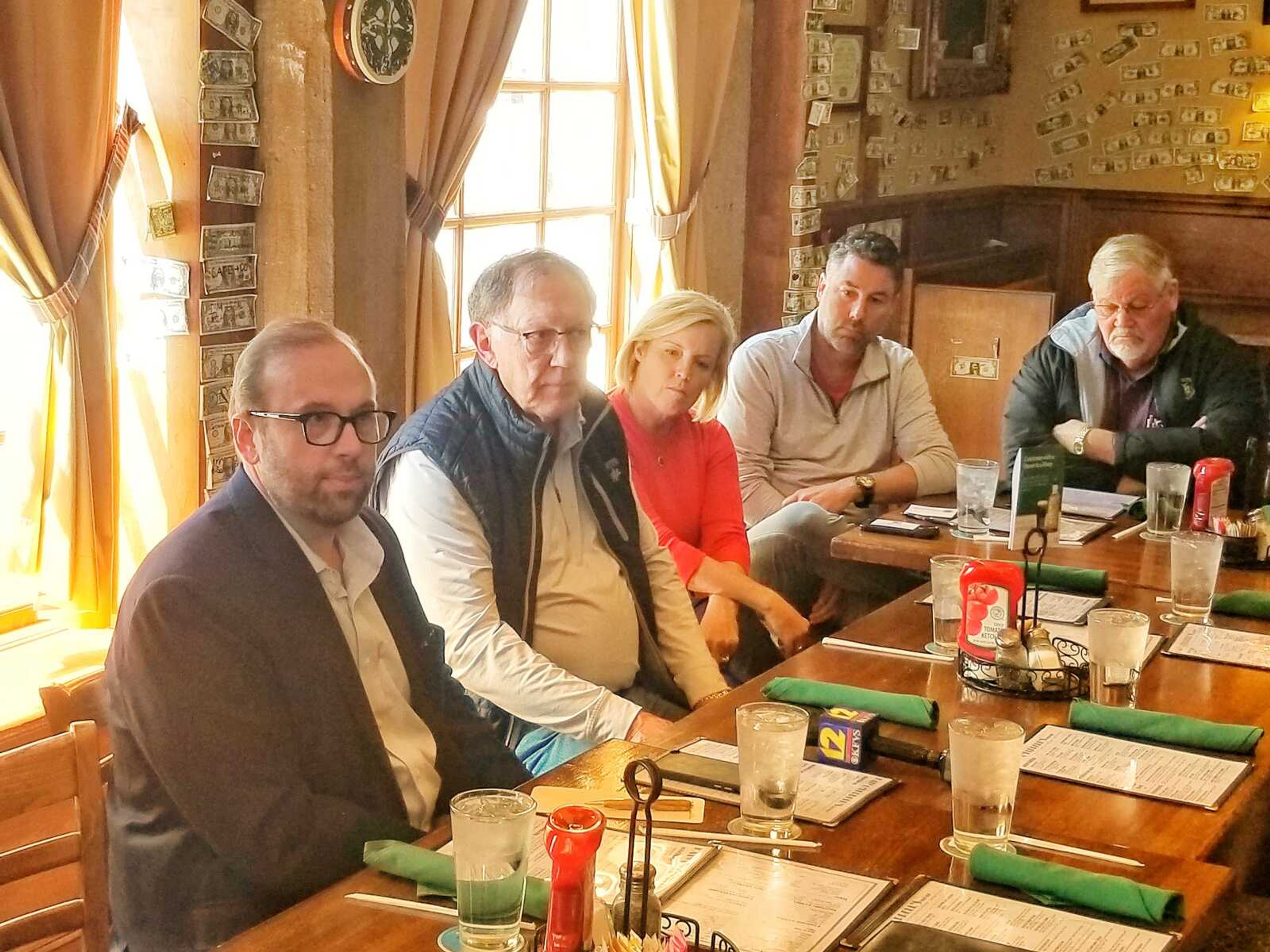 U.S. Rep. Jason Smith, left, discusses government policy with restaurateurs and others Monday, April 24, at Katy O'Ferrell's Publick House in downtown Cape Girardeau. In the hourlong meeting, Smith entertained views on a variety of topics -- ranging from workforce shortages, the impact of taxes and importance of social media. Meeting with Smith were, from left, Poplar Bluff, Missouri, businessman Herman Styles; Cape Girardeau Mayor Stacy Kinder; Jason Coalter of Broussard's Cajun Cuisine; and Dan Drury of Midamerica Hotels.