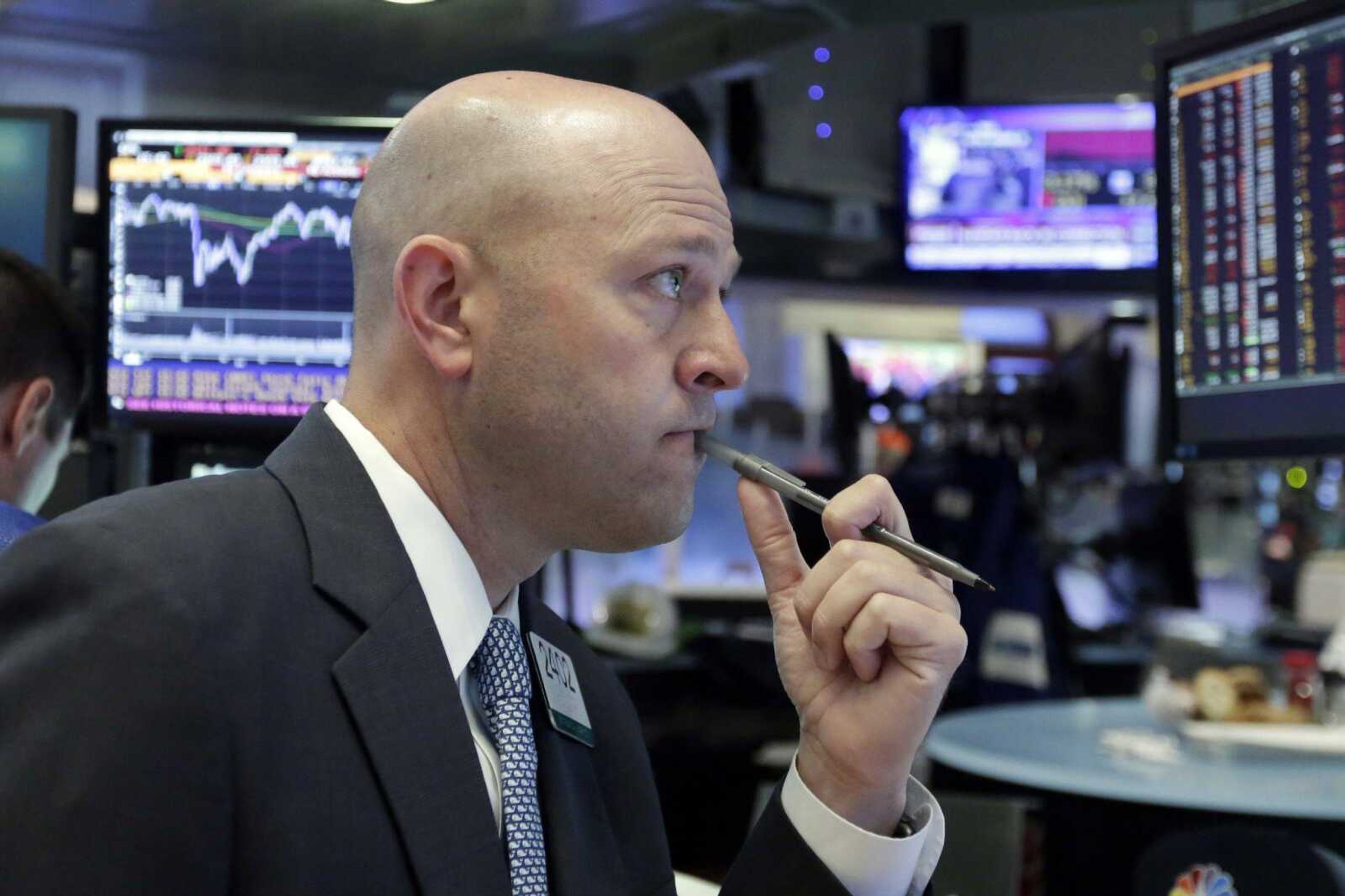 Specialist Jay Woods works Friday on the floor of the New York Stock Exchange. Stocks plunged in the U.S. and worldwide after Britain voted to leave the European Union.