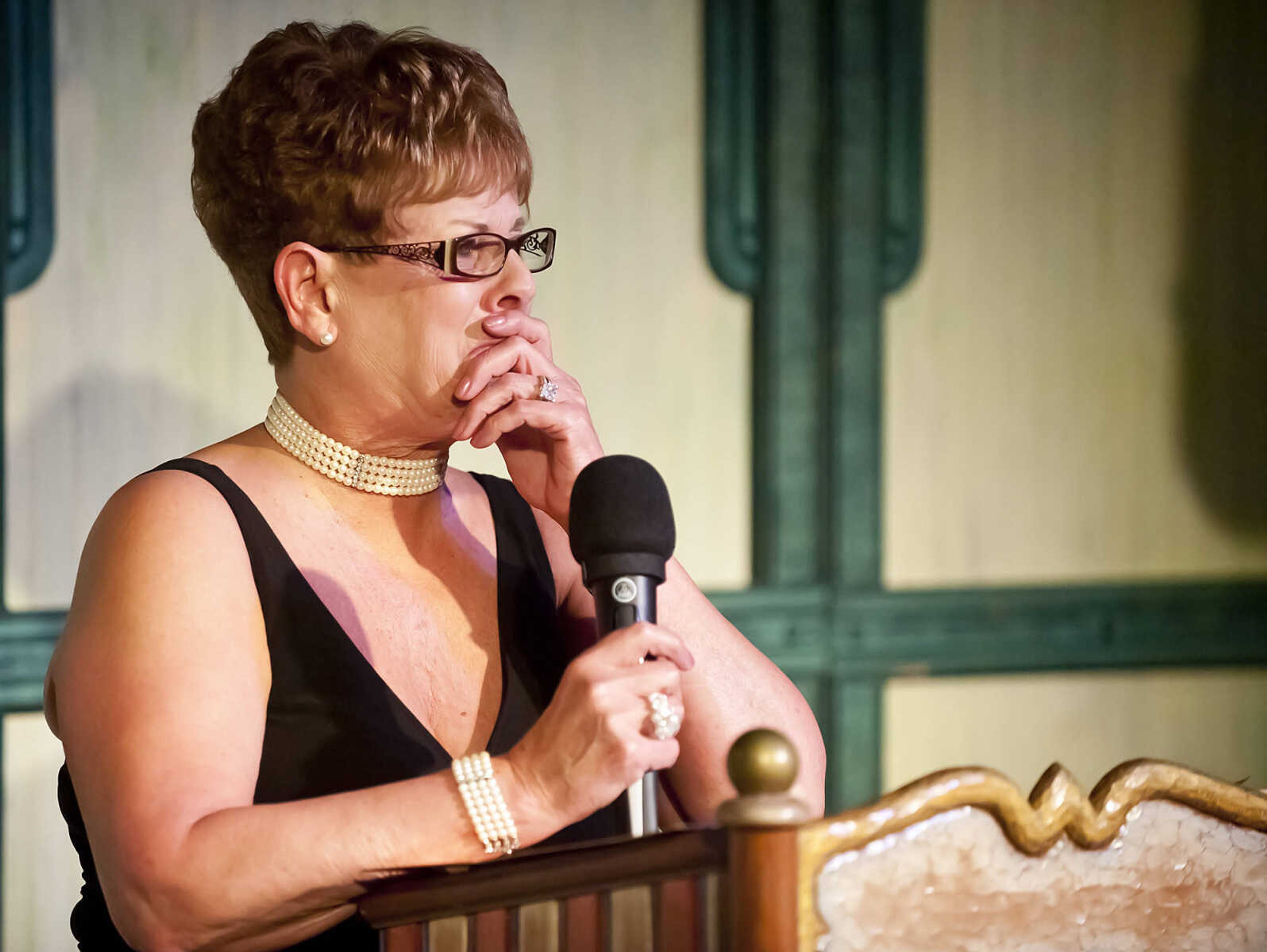 Debbie Barnhouse, president of the River City Players' board of directors, becomes emotional as she announces Joy Baldwin as the winner of the Presidents Award during the Abbott Awards, the River City Players' annual awards ceremony, Saturday, Jan. 18, at Port Cape in downtown Cape Girardeau. Auditions for the first production of the 2014 season, "Quiet on the Set," will be held at 7 p.m. Jan. 29 and 30 at Port Cape.