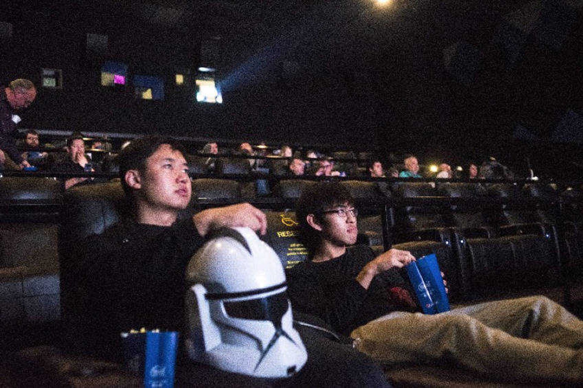 Zacharie Gao, left, leans on his stormtrooper helmet next to Takumi Ogawa, right, before the 6 p.m. Thursday showing of "Star Wars: The Last Jedi" at Cape West Cinema in Cape Girardeau.
