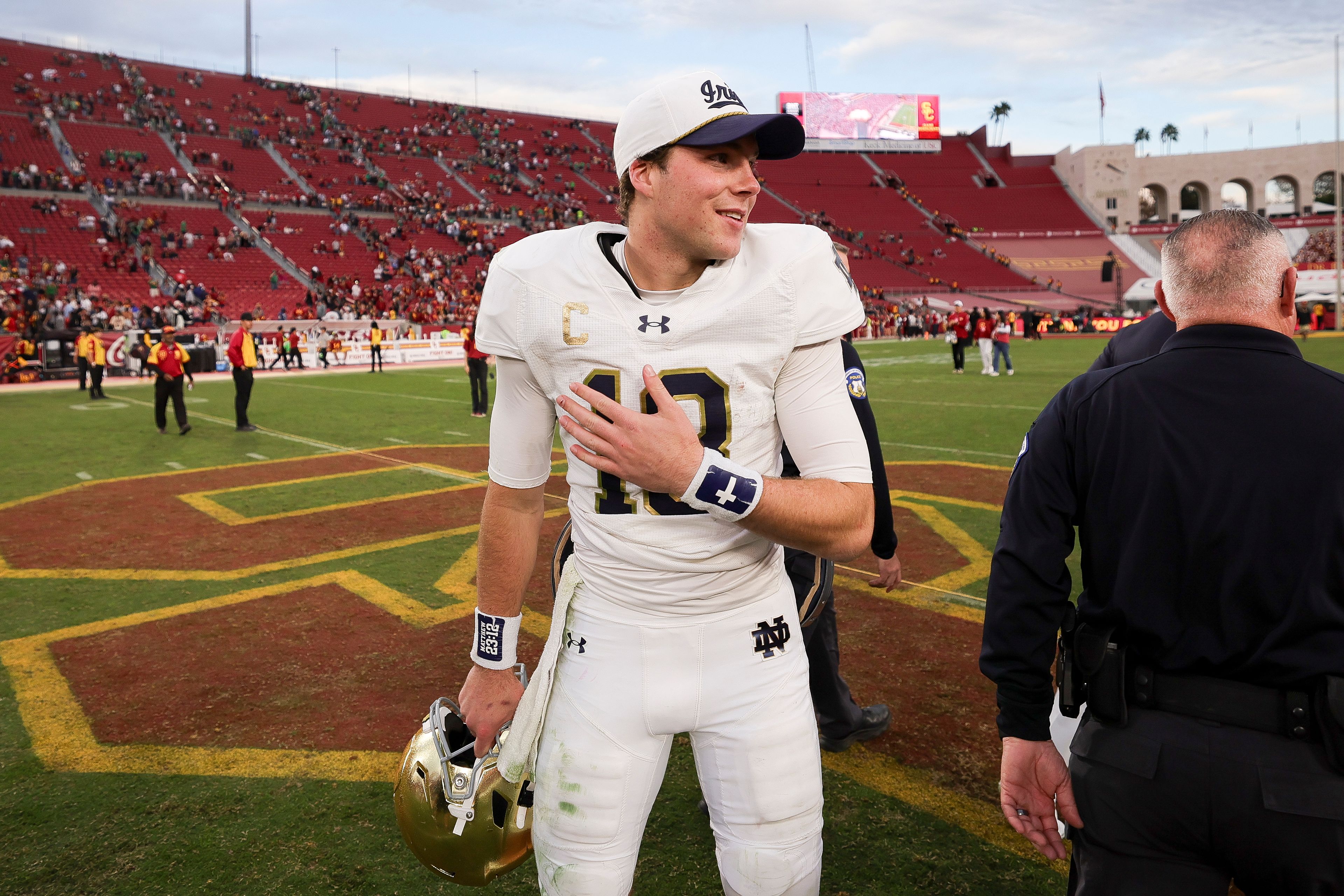 Notre Dame quarterback Riley Leonard reacts after the team's win against Southern California in an NCAA college football game Saturday, Nov. 30, 2024, in Los Angeles. (AP Photo/Ryan Sun)