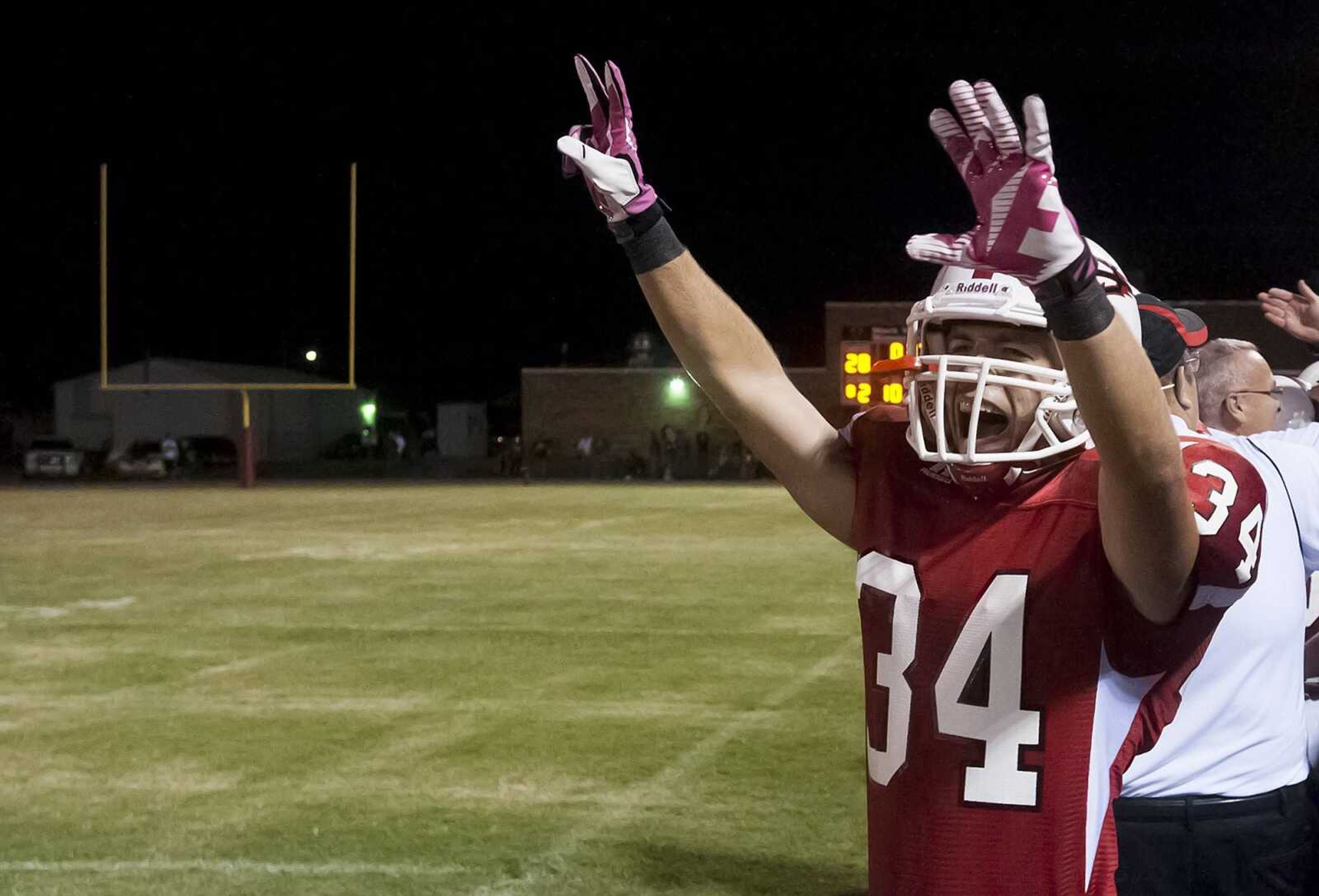 Chaffee's Thomas Robbins celebrates as the clock runs out in the fourth quarter of the Red Devil's 28-18 win over the Malden Green Wave Friday at Chaffee High School. (Adam Vogler)