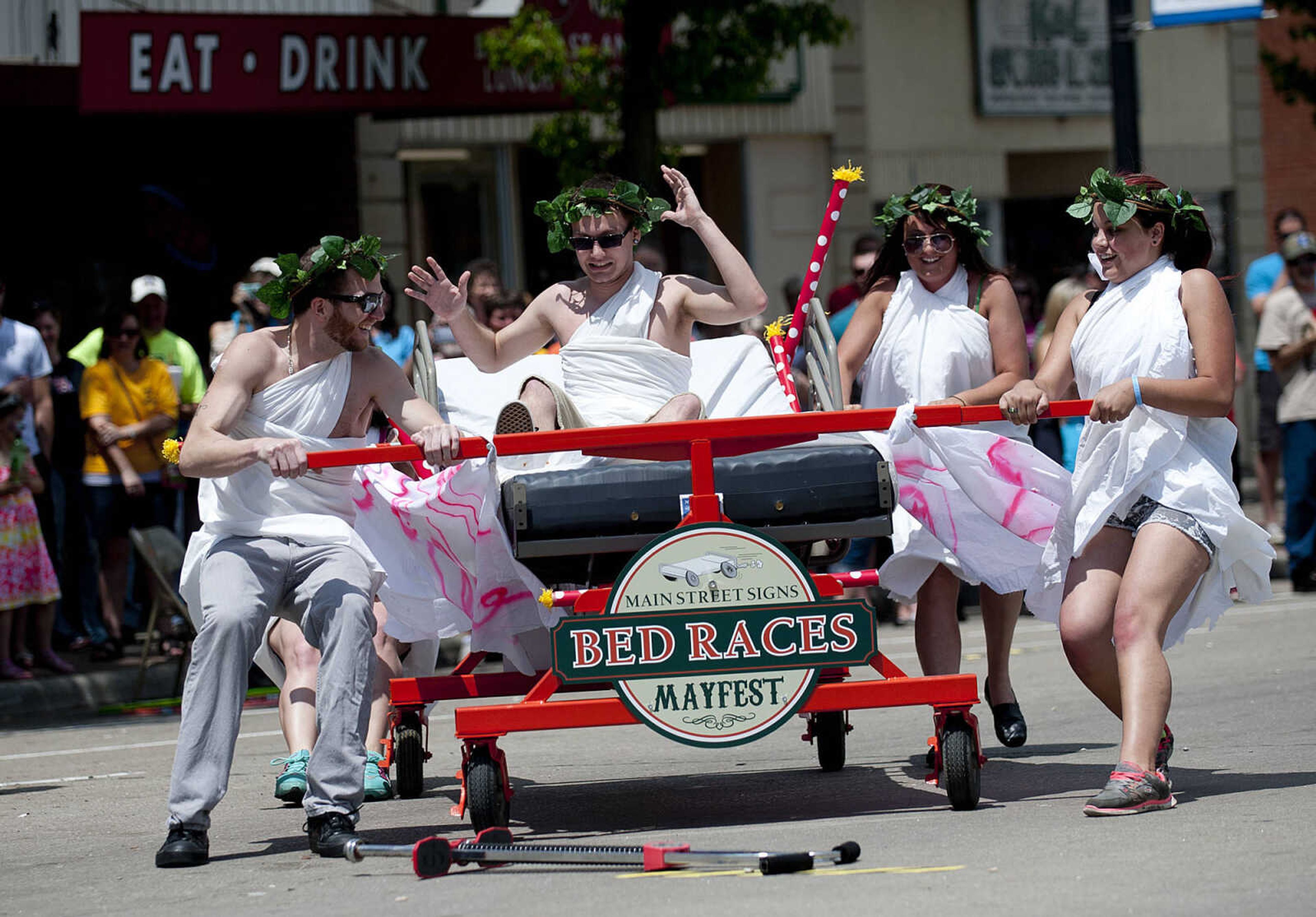 The Animal House team sponsored by Mary Jane, Burgers and Brew, compete in the Perryville Mayfest Bed Races Saturday, May 10, in Perryville, Mo.