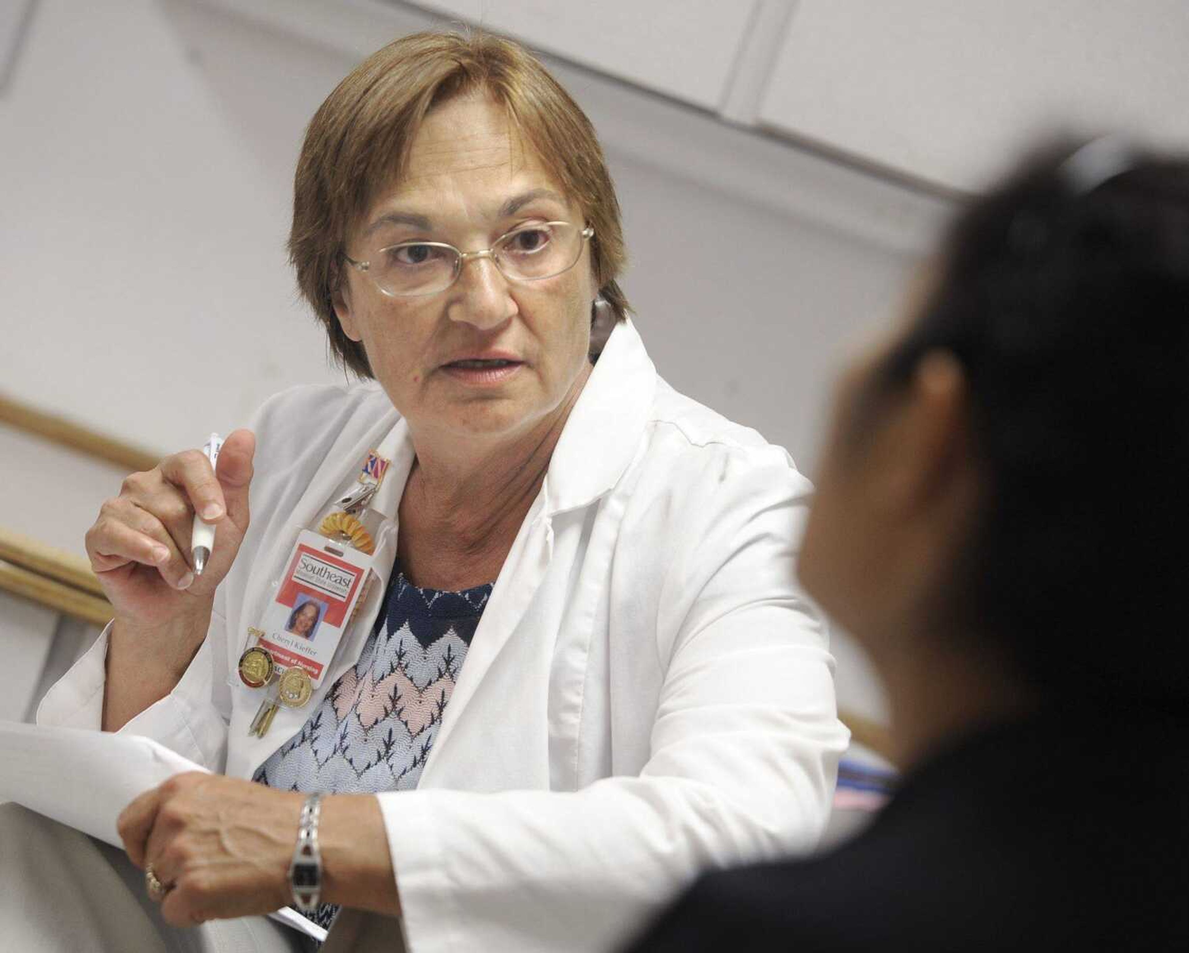 Cheryl Essner, assistant professor of nursing at Southeast Missouri State University, has a conference with a nursing student Wednesday, June 20, 2012 at Saint Francis Medical Center. (Fred Lynch)