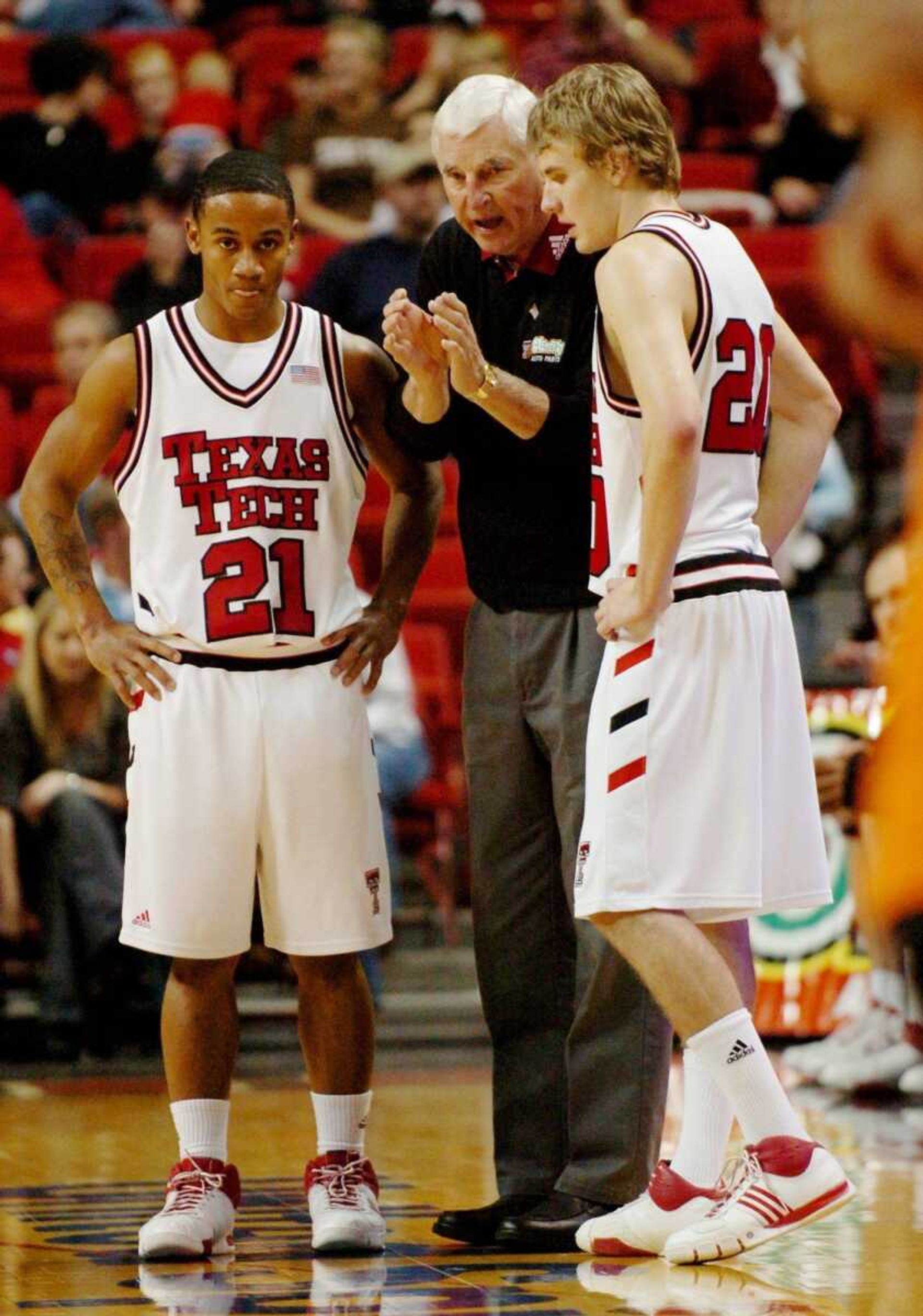 Texas Tech coach Bob Knight, center, is one win away from becoming the first Division I men's coach to win 900 games. (JOE DON BUCKNER ~ Associated Press)