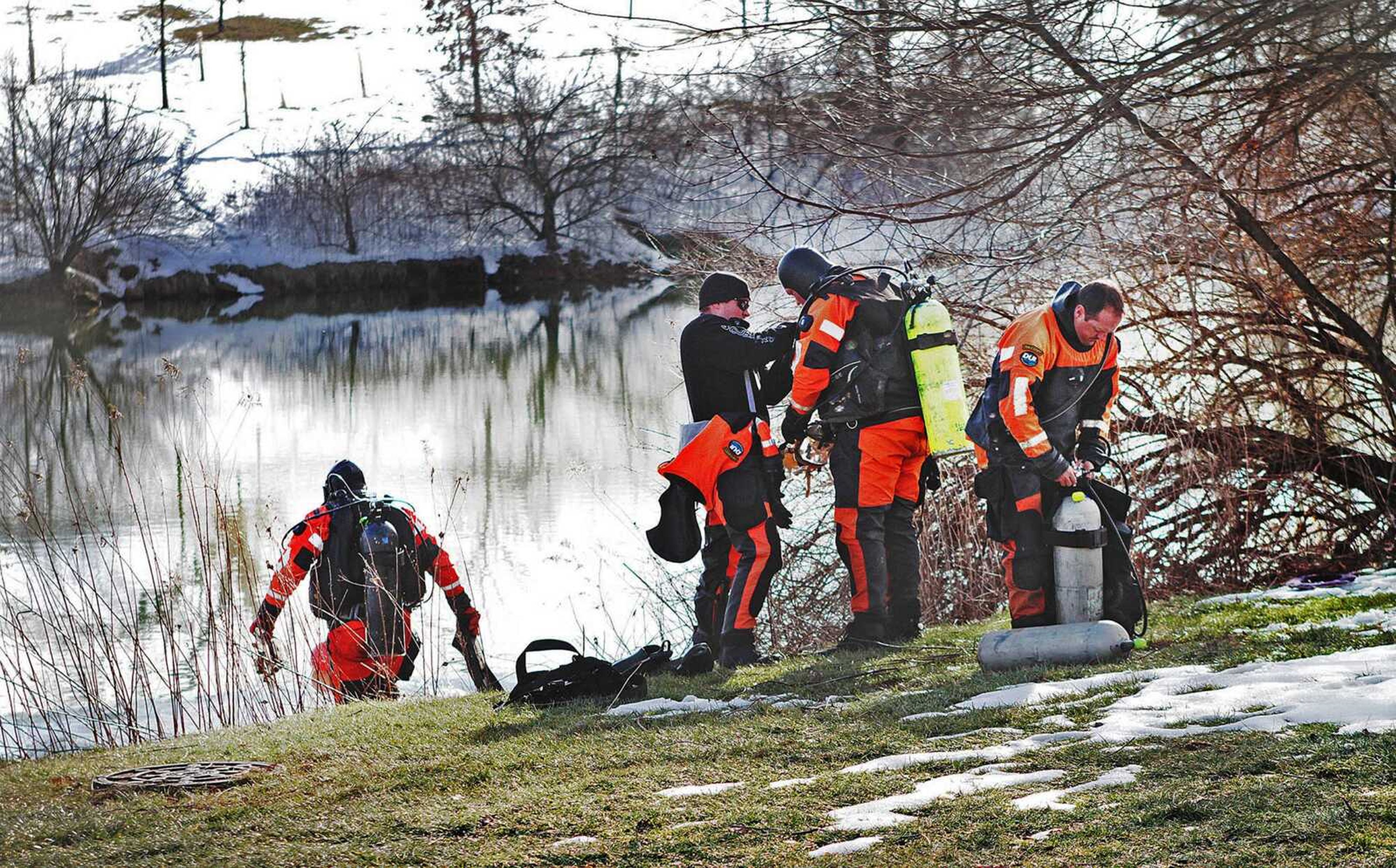 Troopers prepare to search the Duck Pond in Blacksburg, Virginia. The investigation continued in the death of Nicole Madison Lovell as a state police search team searched a pond for evidence on the Virginia Tech campus.