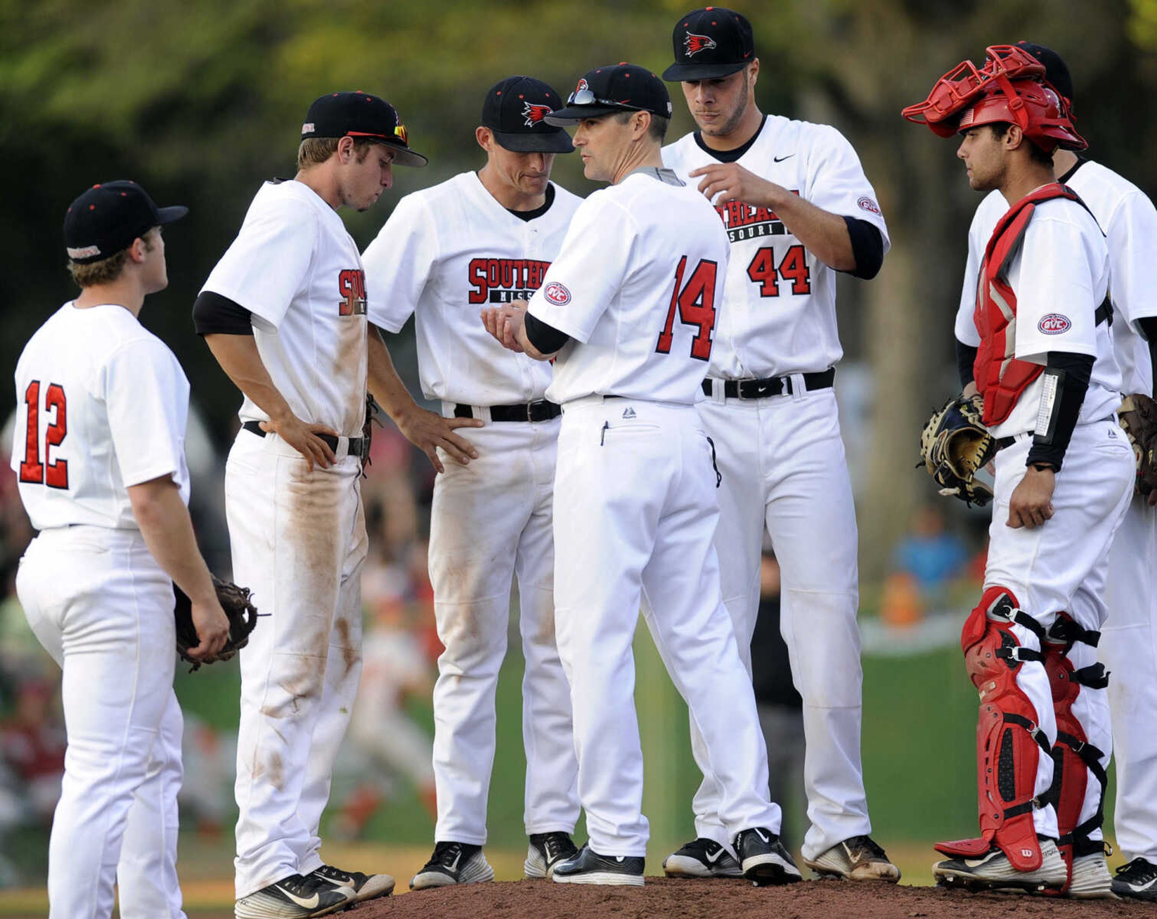 Southeast Missouri State coach Steve Bieser talks with his players on the mound during the eighth inning against Jacksonville State Friday, April 17, 2015 at Capaha Field. (Fred Lynch)