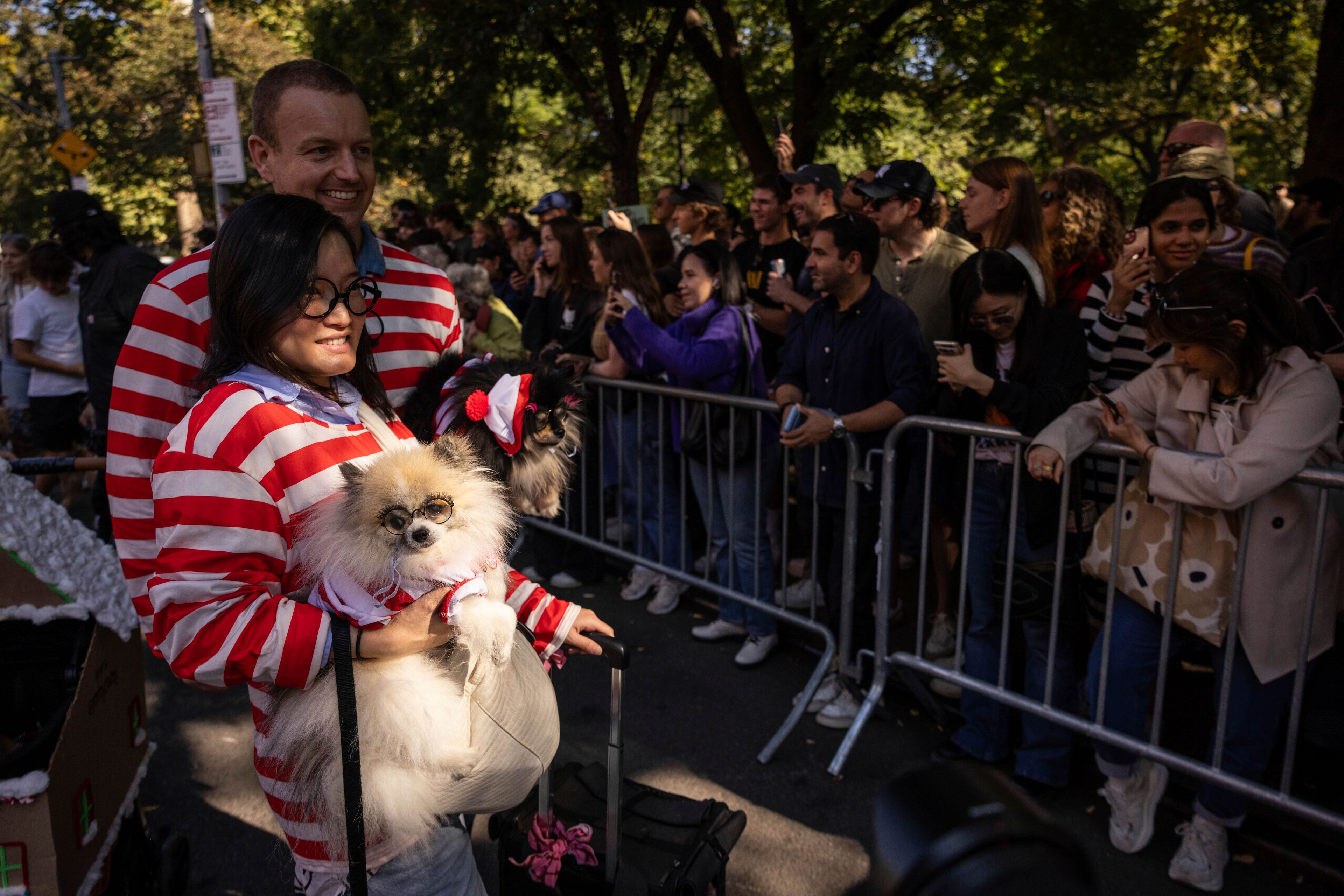 People and their dogs in costume participate in the 34th annual Tompkins Square Halloween Dog Parade, Saturday, Oct. 19, 2024, in New York. (AP Photo/Yuki Iwamura)