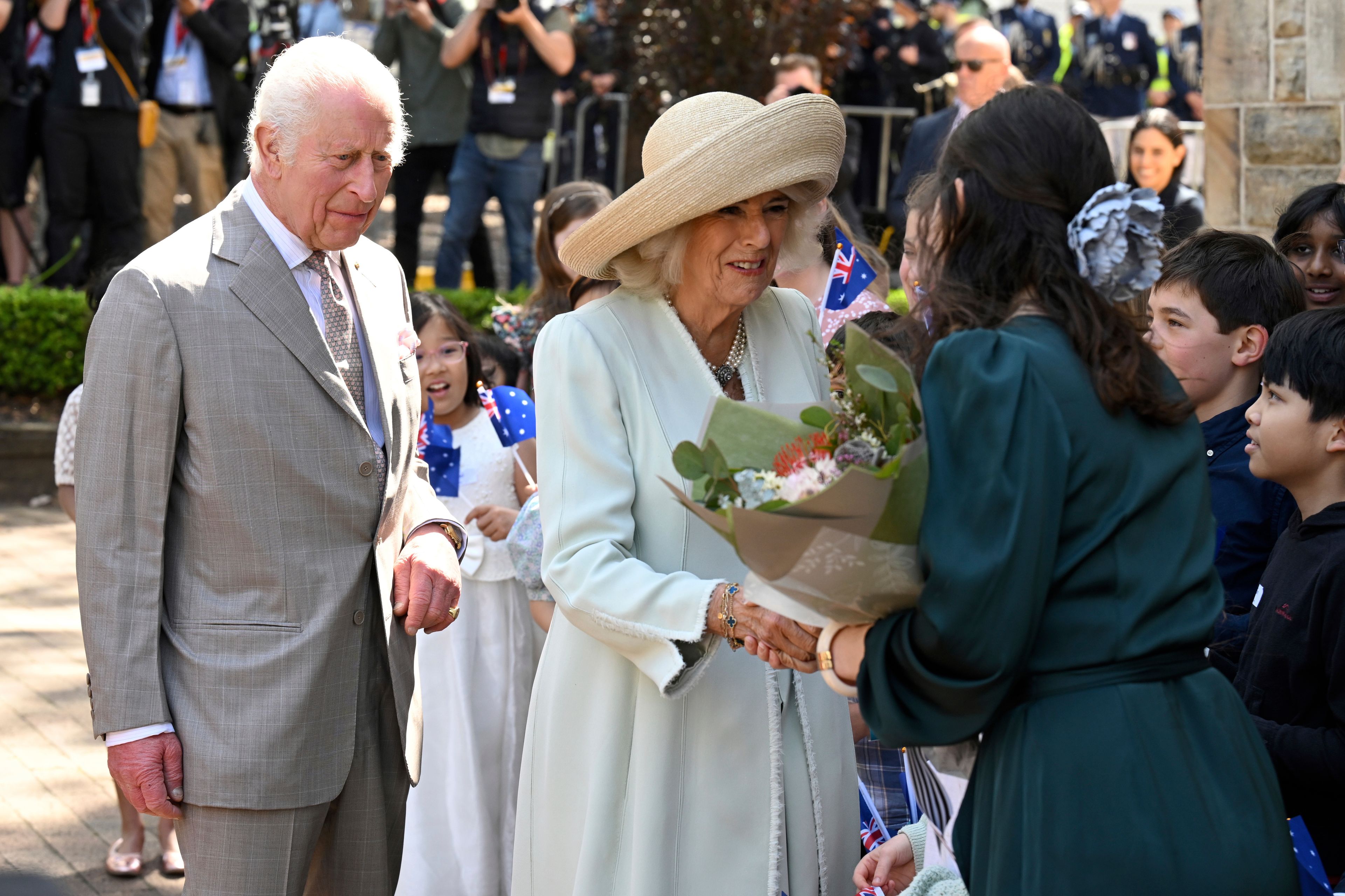 King Charles III, left, and Queen Camilla, center, greet people during a visit to St Thomas' Anglican Church in Sydney, Sunday, Oct. 20, 2024. (Dean Lewins/Pool Photo via AP)