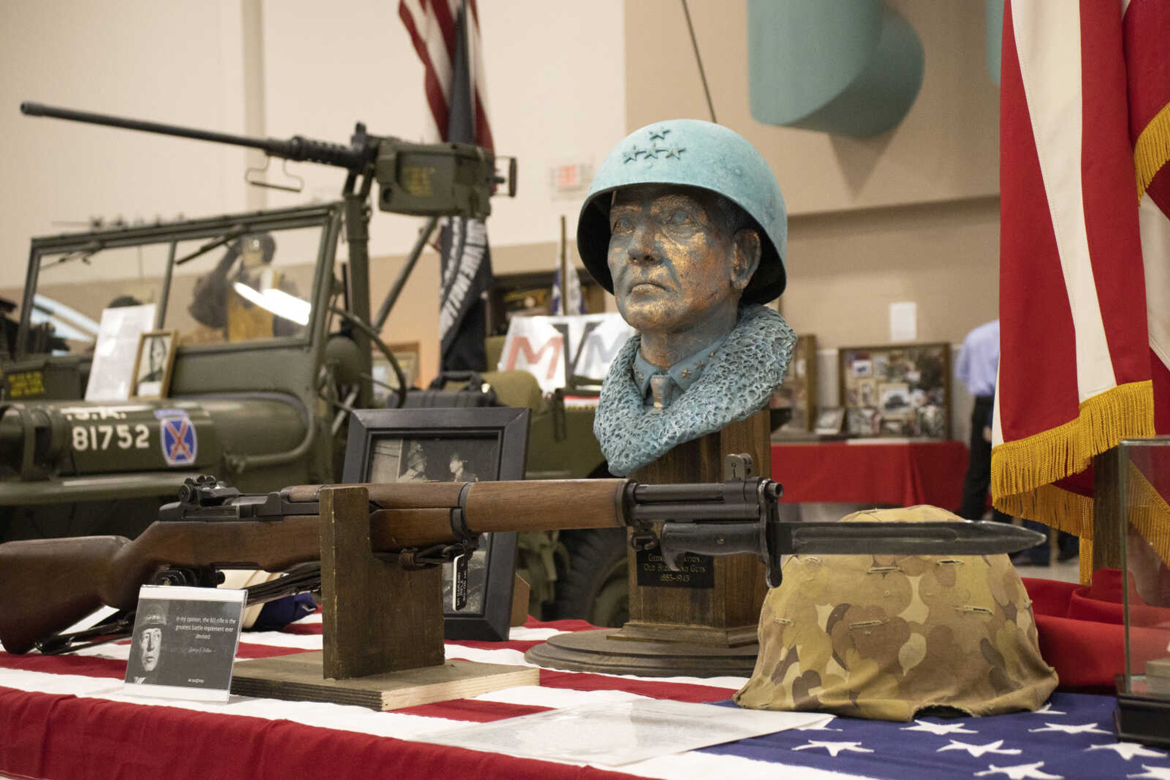 A bust of George S. Patton sits on top of tables displaying historical items at the Spirit of Democracy dinner on Saturday.