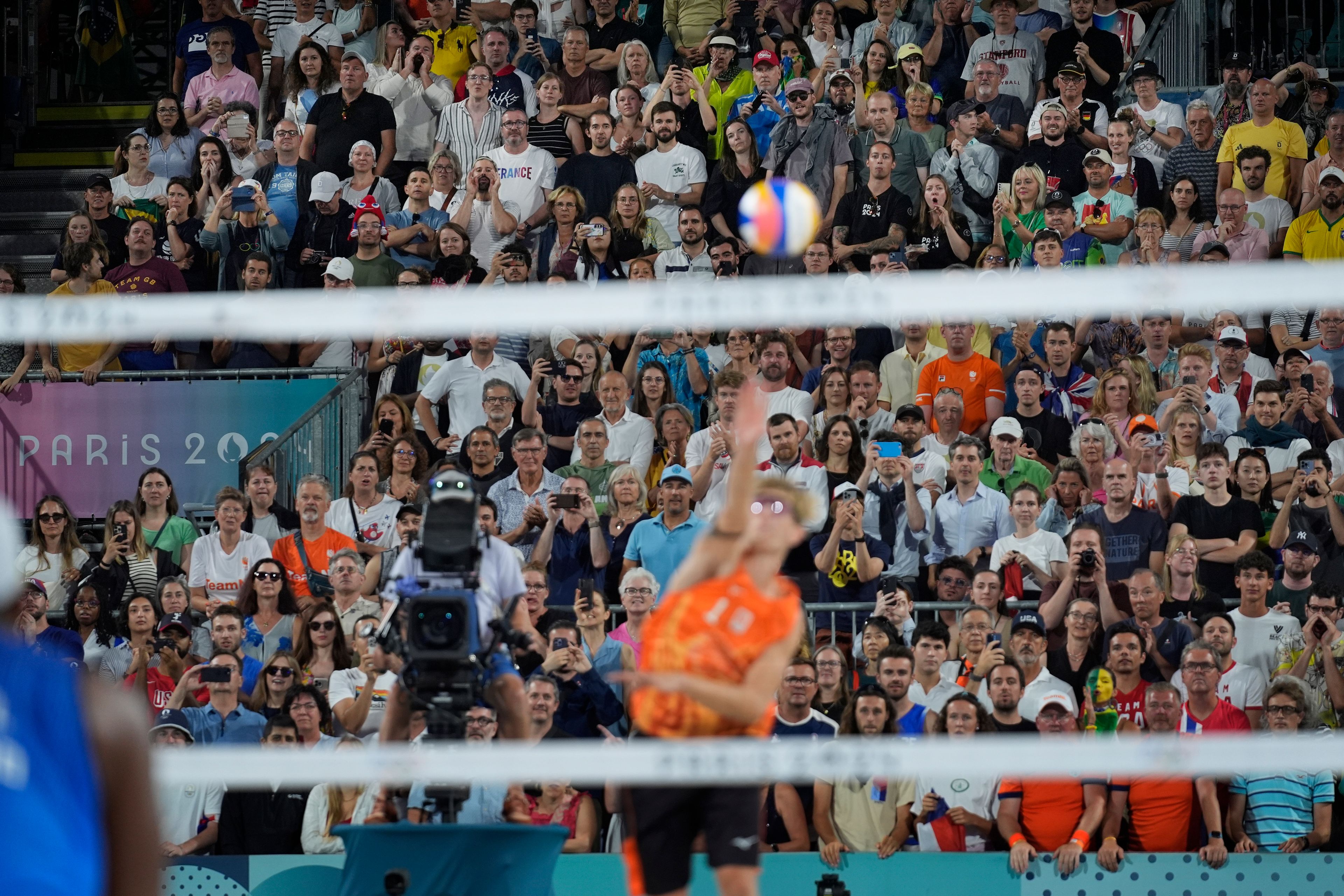 Spectators boo Netherland's Steven van de Velde as he serves to Brazil in a beach volleyball match at the 2024 Summer Olympics, Sunday, Aug. 4, 2024, in Paris, France. (AP Photo/Robert F. Bukaty)