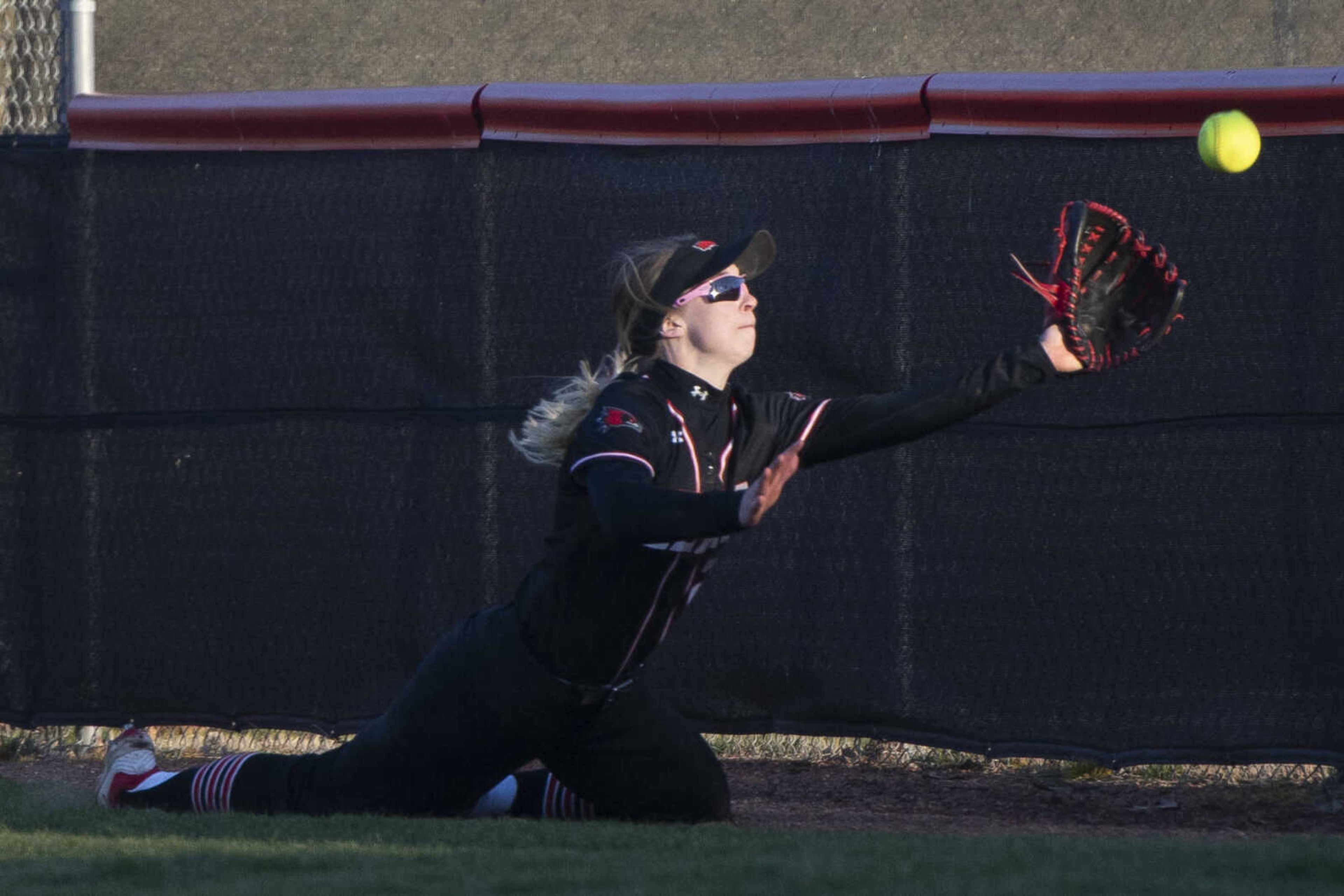 Southeast senior Madison Harris (22) prepares to make a catch during the Southeast Missouri State University Redhawks' 3-0 victory over University of Missouri-Kansas City on Saturday, Feb. 29, 2020, at the Southeast Softball Complex in Cape Girardeau.