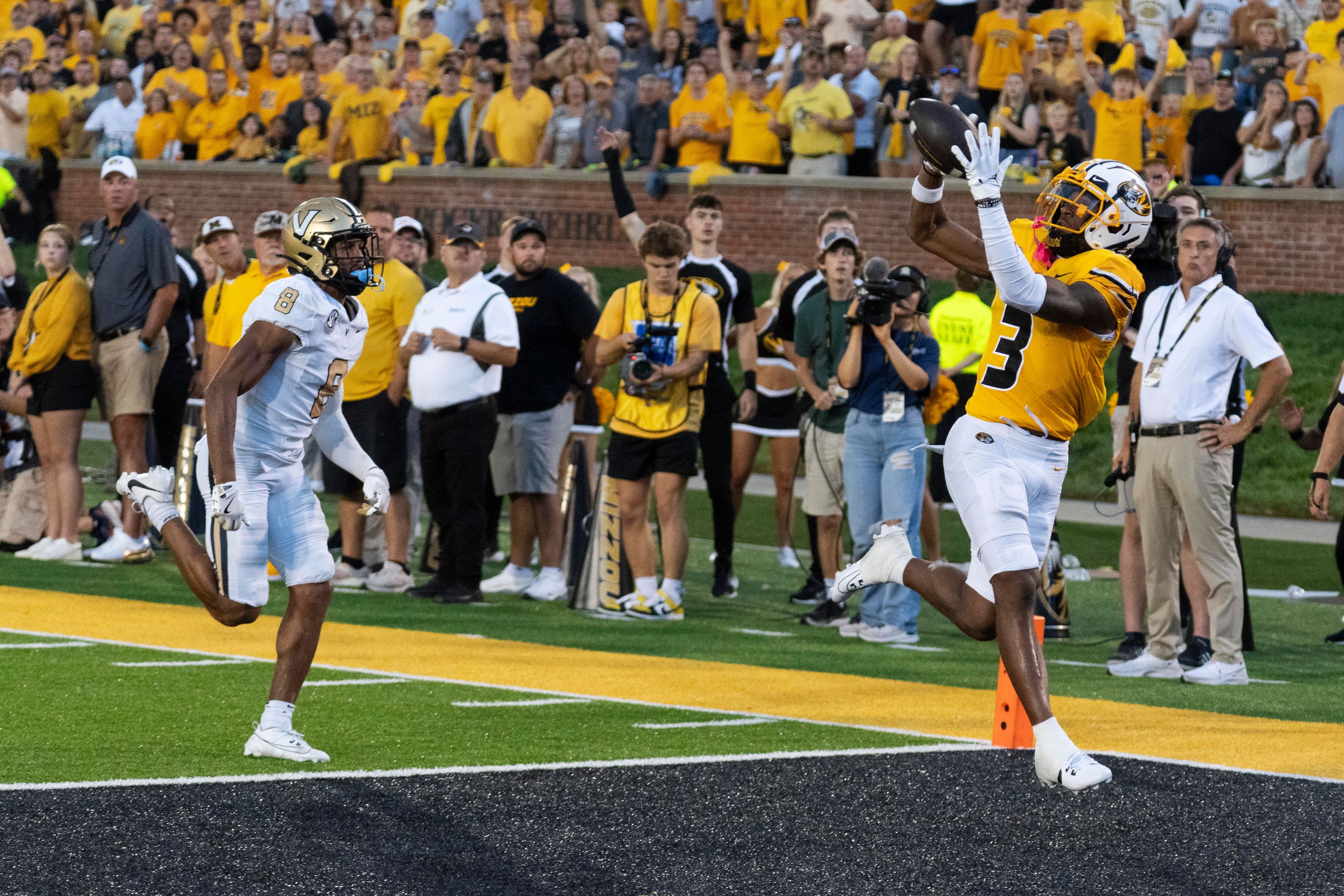 Missouri wide receiver Luther Burden III (3) catches a touchdown pass over Vanderbilt cornerback Tyson Russell (8) during overtime of an NCAA college football game Saturday, Sept. 21, 2024, in Columbia, Mo. (AP Photo/L.G. Patterson)