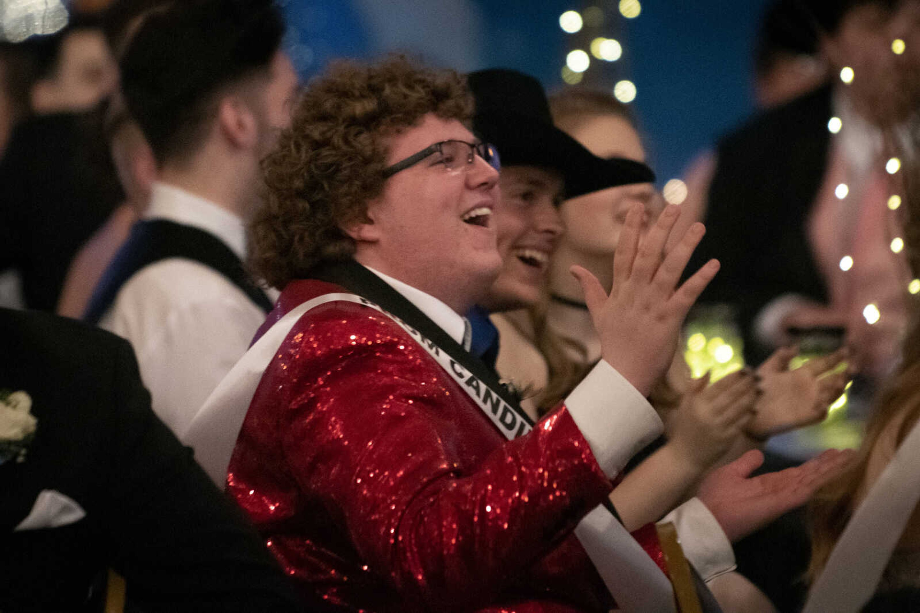 Scott City senior Andrew Johnston laughs at a slideshow played during Scott City's prom next to fellow Scott City senior Kolbe Drury on Saturday, April 6, 2019, at Deerfield Lodge in Cape Girardeau.