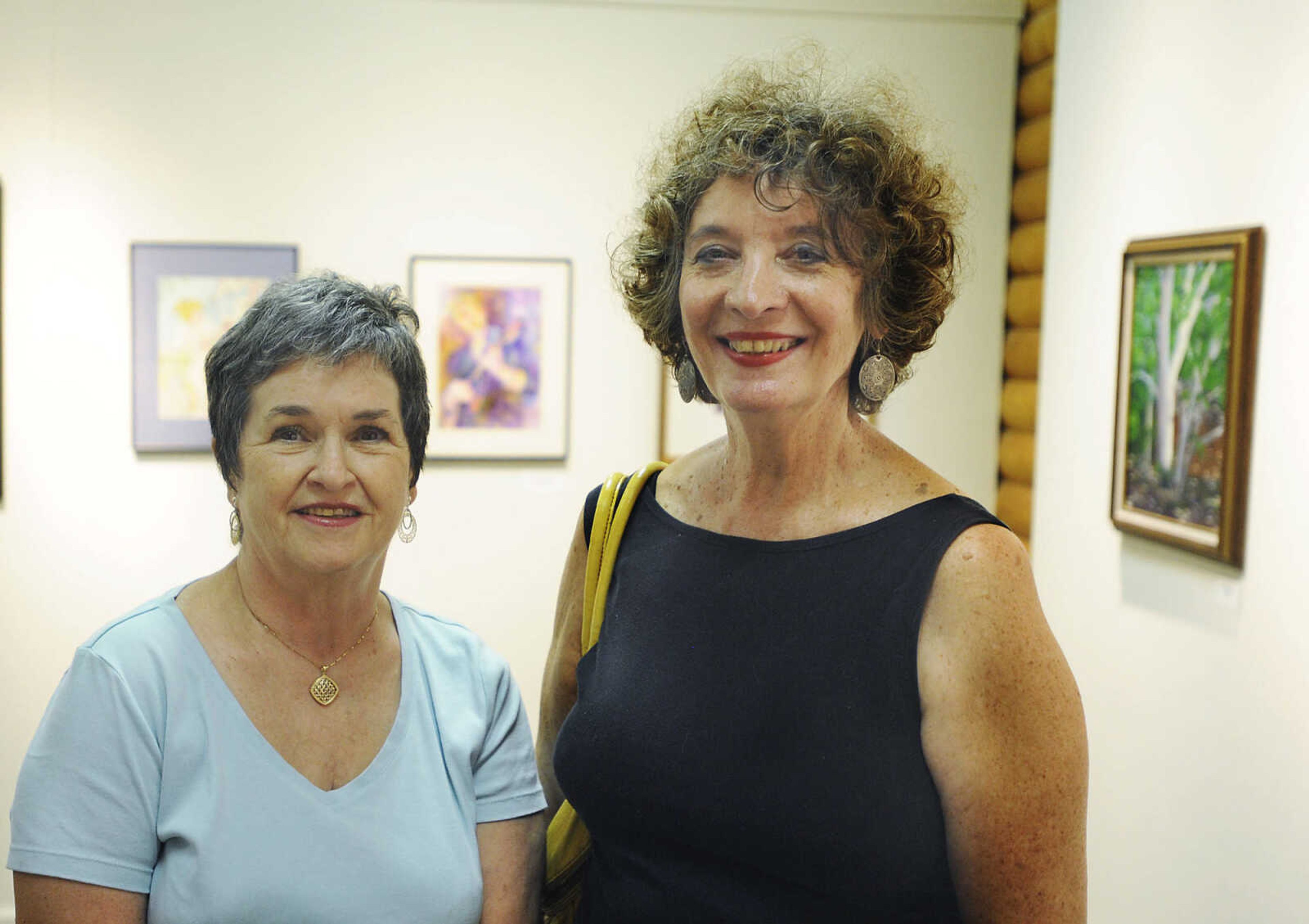 Ava Allen, left, and Sally Tierney Friday, July 6, at the Cape Arts Council, 32 N. Main Street, during First Friday. The first Friday of each month galleries in Downtown Cape Girardeau hold openings from 5 p.m to 9 p.m. with food, drink and the opportunity to talk with the artists about their work.