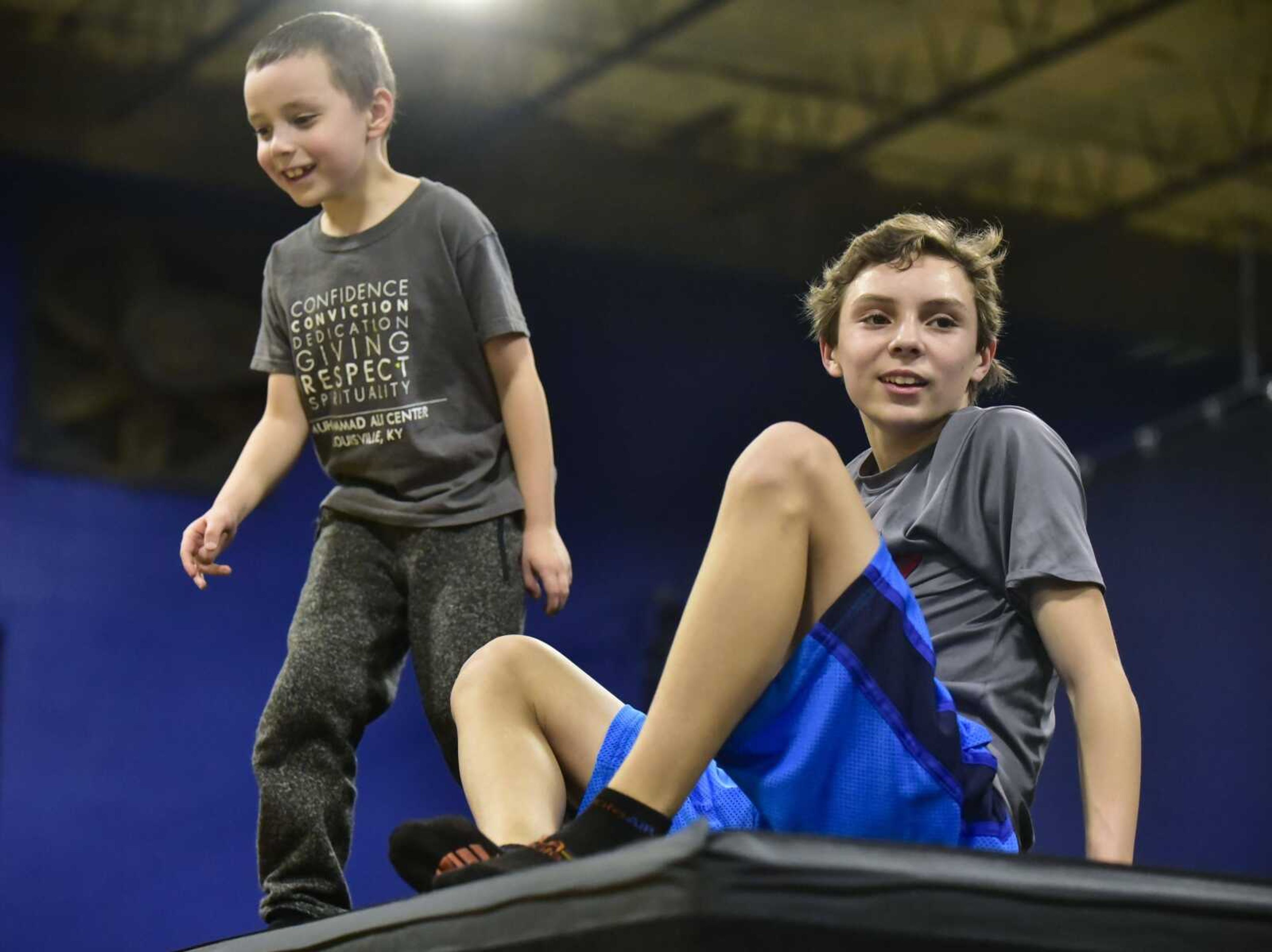 Christian Batteau, 7, stands next to his brother, Dawson Jackson, 14, during an Easterseals Midwest monthly outing Tuesday, Feb. 13, 2018, at Ultimate Air Trampoline Park in Scott City.