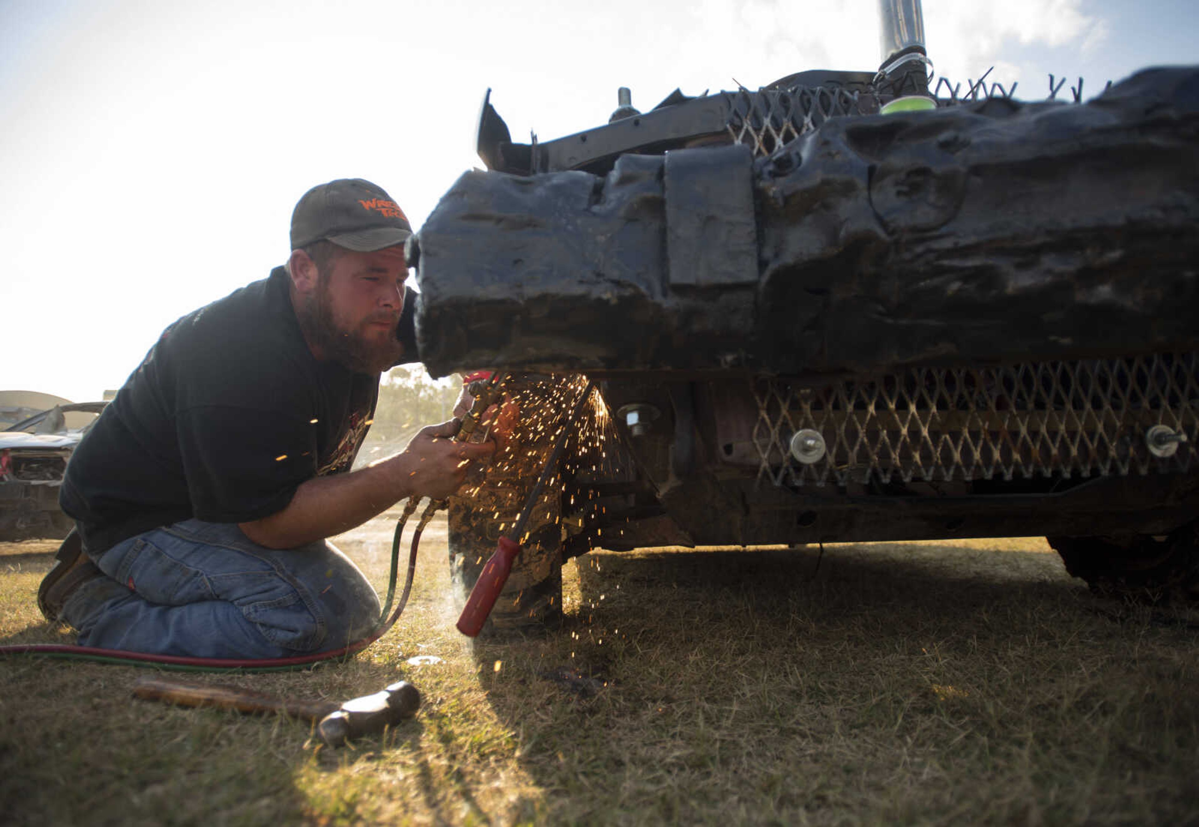 Keith Gross of Scott City cuts plate off his car before the Auto Tire & Parts Dual Demo Derby September 9, 2017, at the SEMO District Fair in Cape Girardeau.