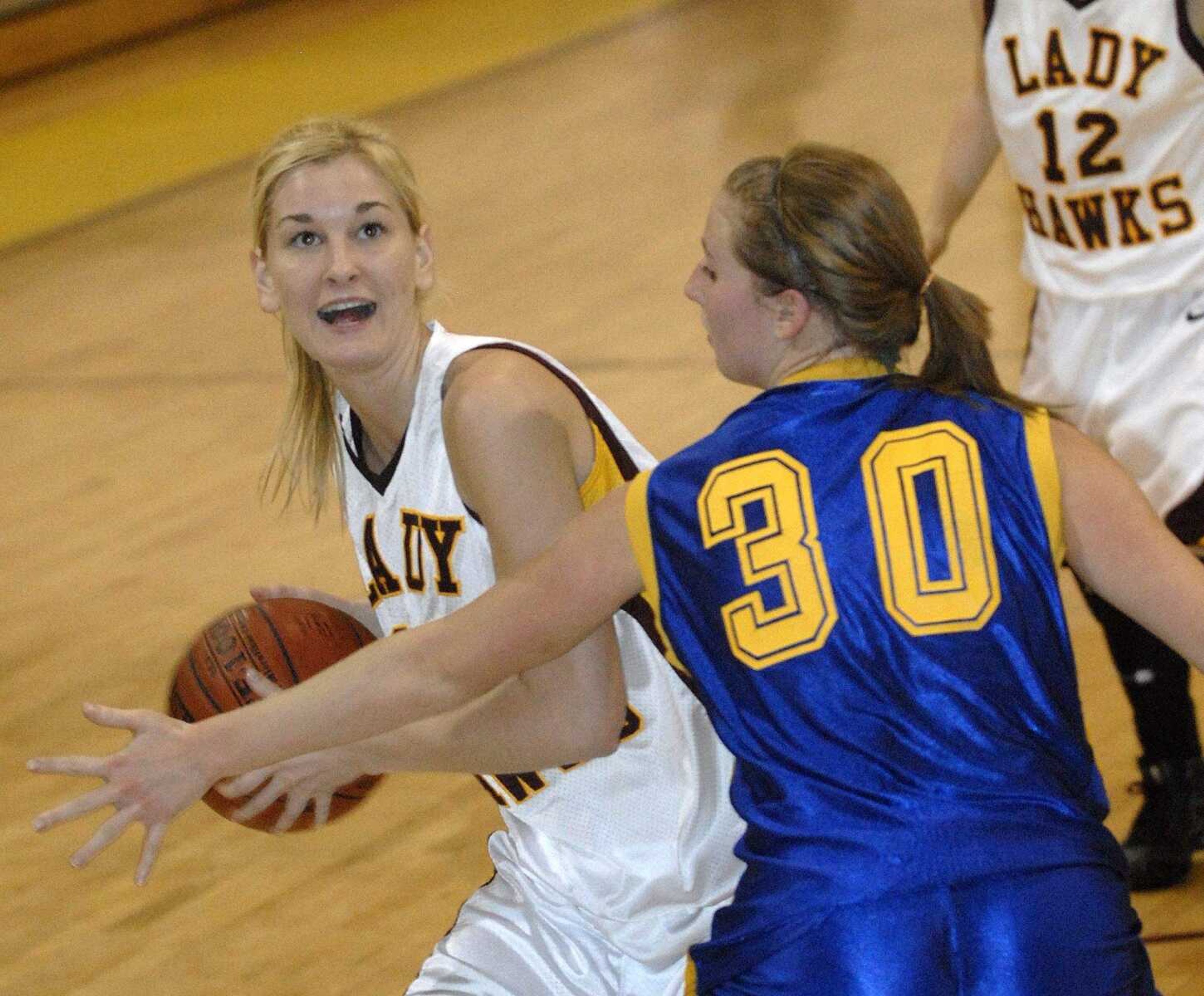 FRED LYNCH ~ flynch@semissourian.com
Kelly's Neely Tetley drives against St. Vincent's Alicia Zarlingo in the third quarter Monday at Kelly High School.