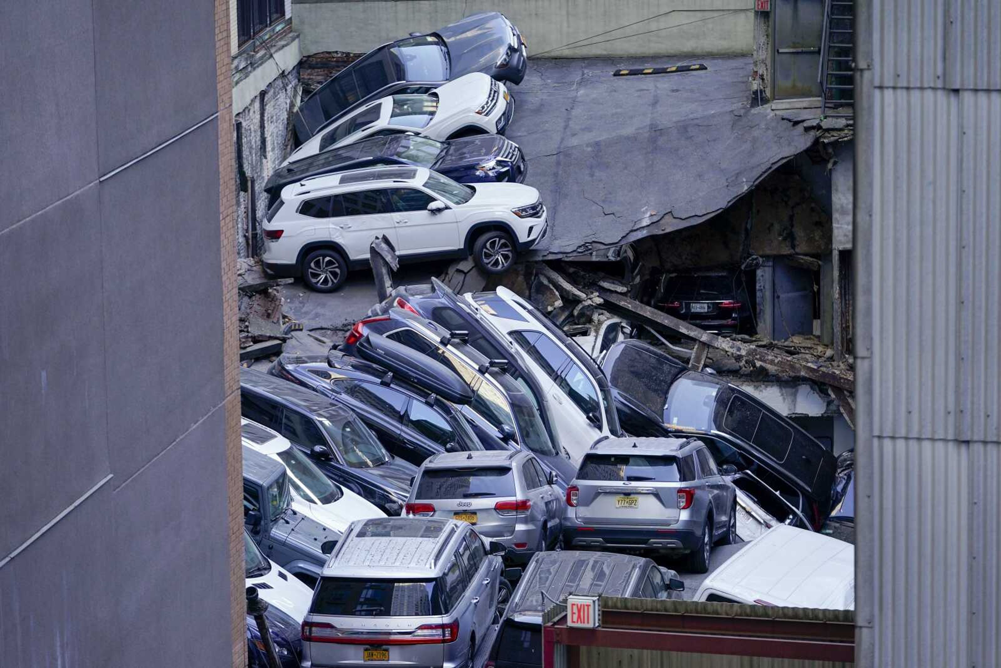 Cars are seen piled on top of each other at the scene of a partial collapse of a parking garage Tuesday in New York.