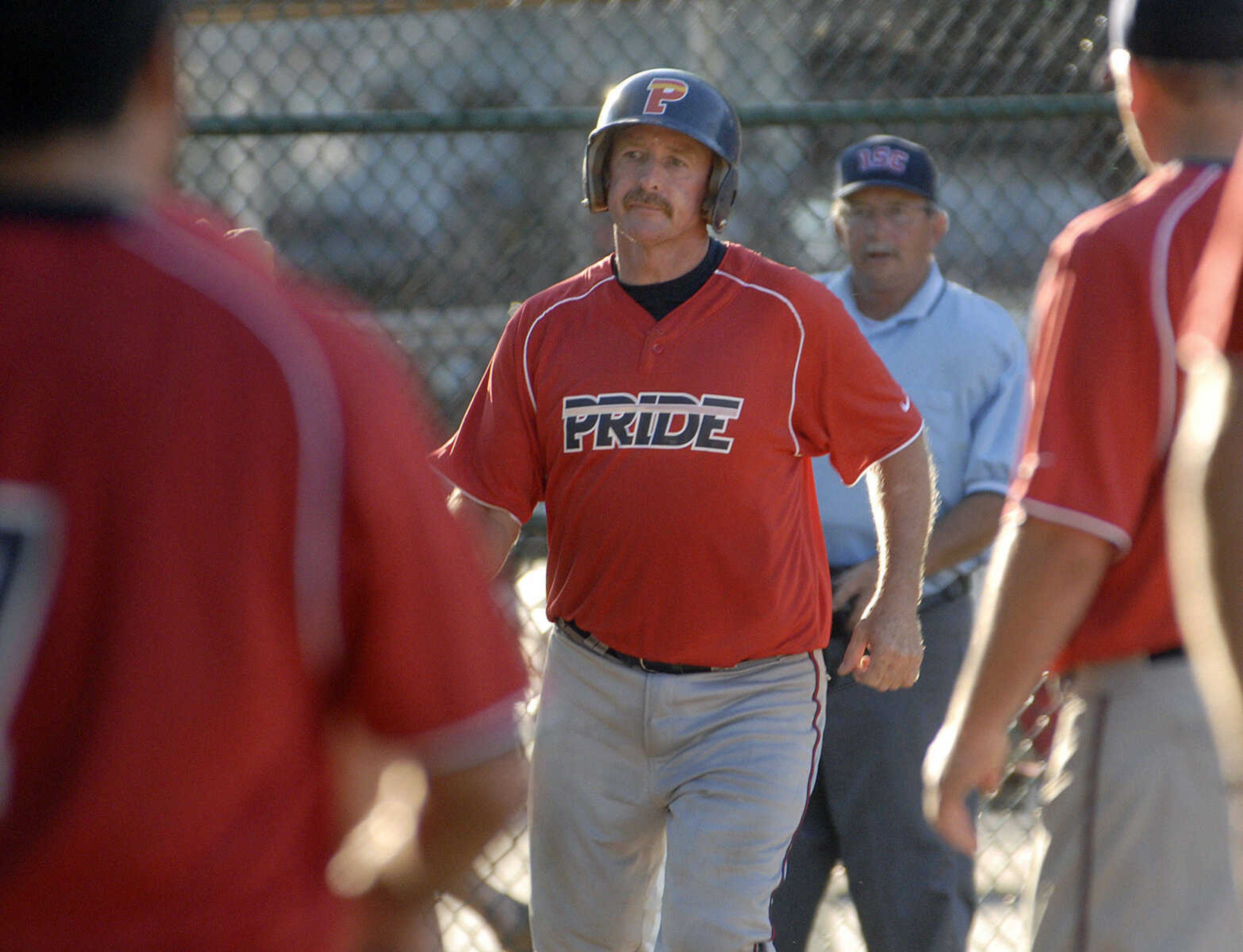 Decatur Pride's Greg Morganthaler crosses the plate after his home run against Nokomis during the fourth inning of the championship game Sunday at the Kelso Klassic.