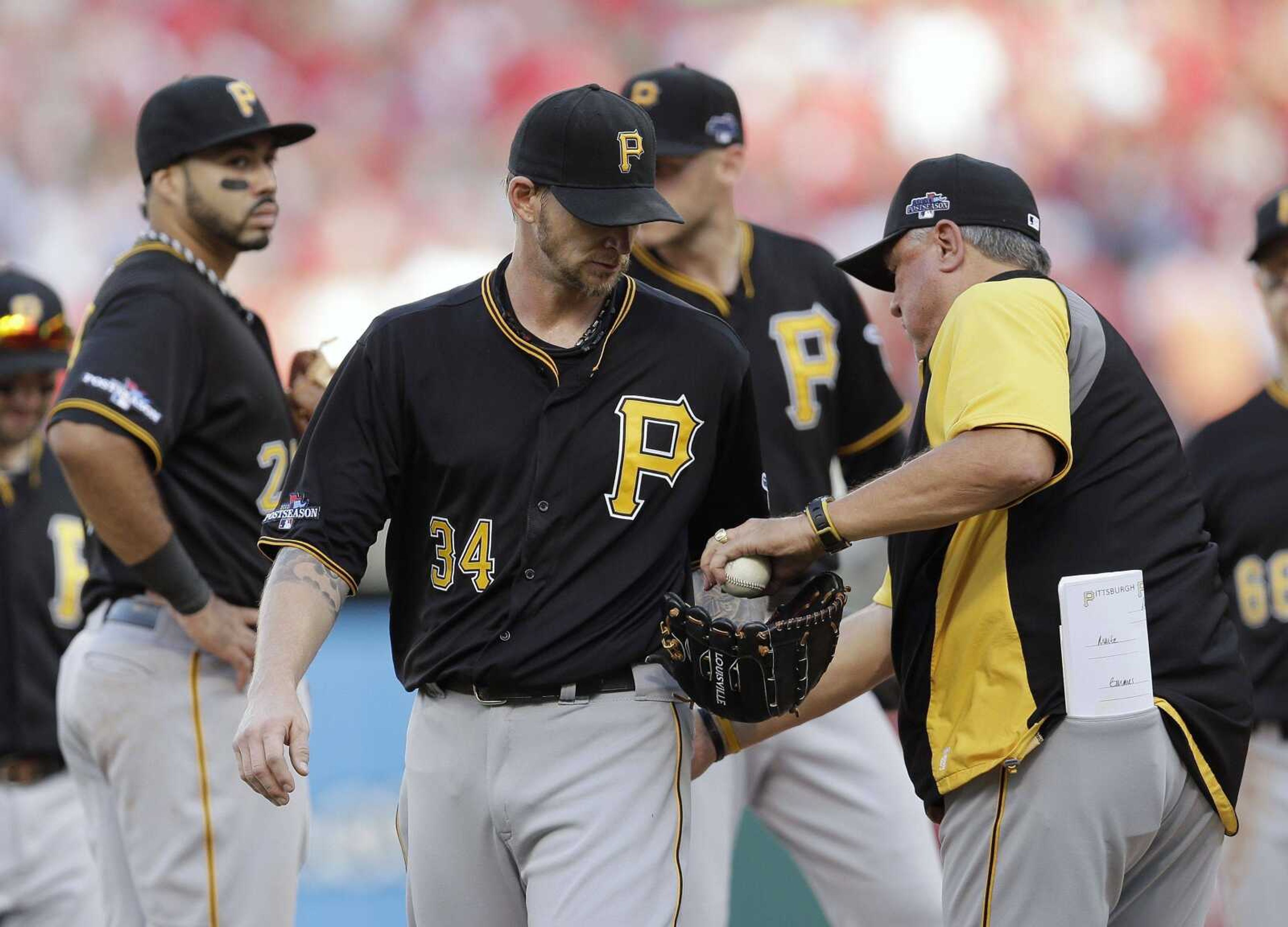 Pirates starting pitcher A.J. Burnett is removed by manager Clint Hurdle, right, during the third inning of Game 1 of the NLDS. (CHARLIE RIEDEL ~ Associated Press)