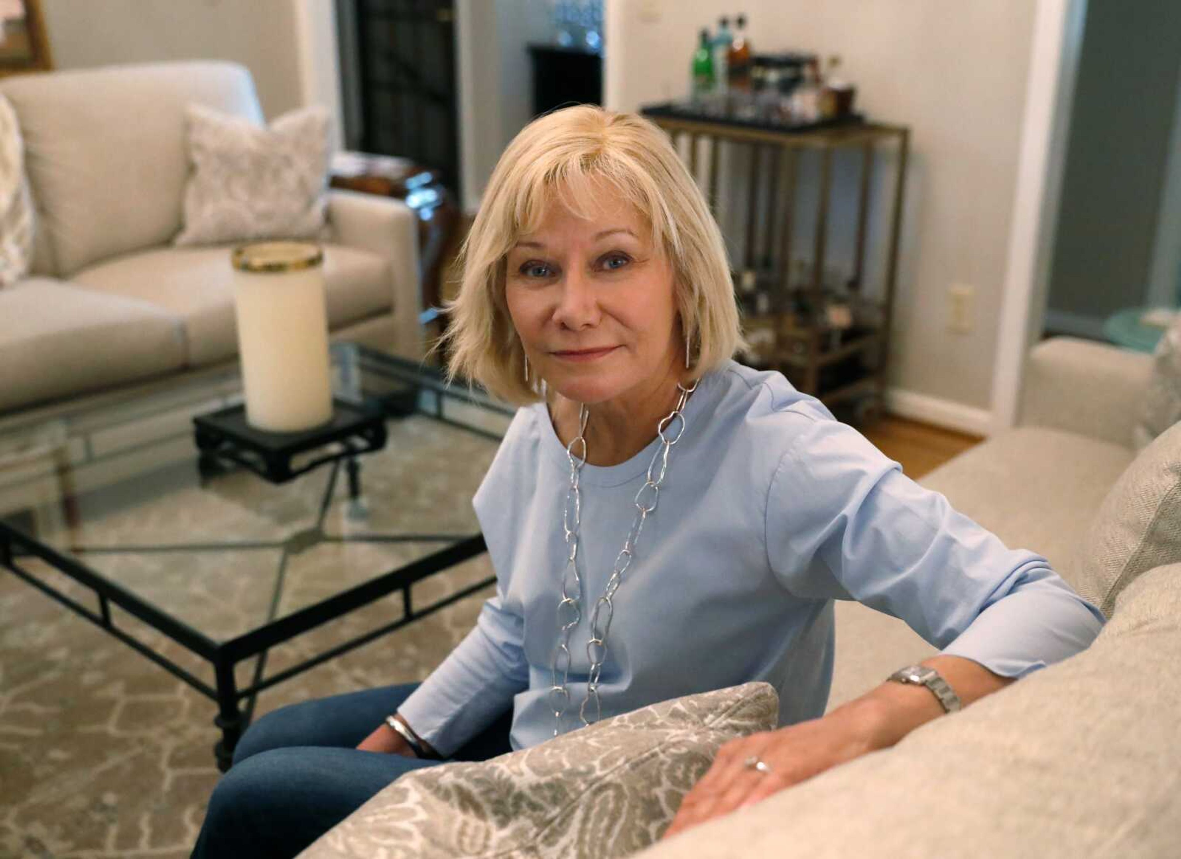 Cancer patient Kim Lauerman poses for a portrait June 26 in her home in Alpharetta, Georgia.