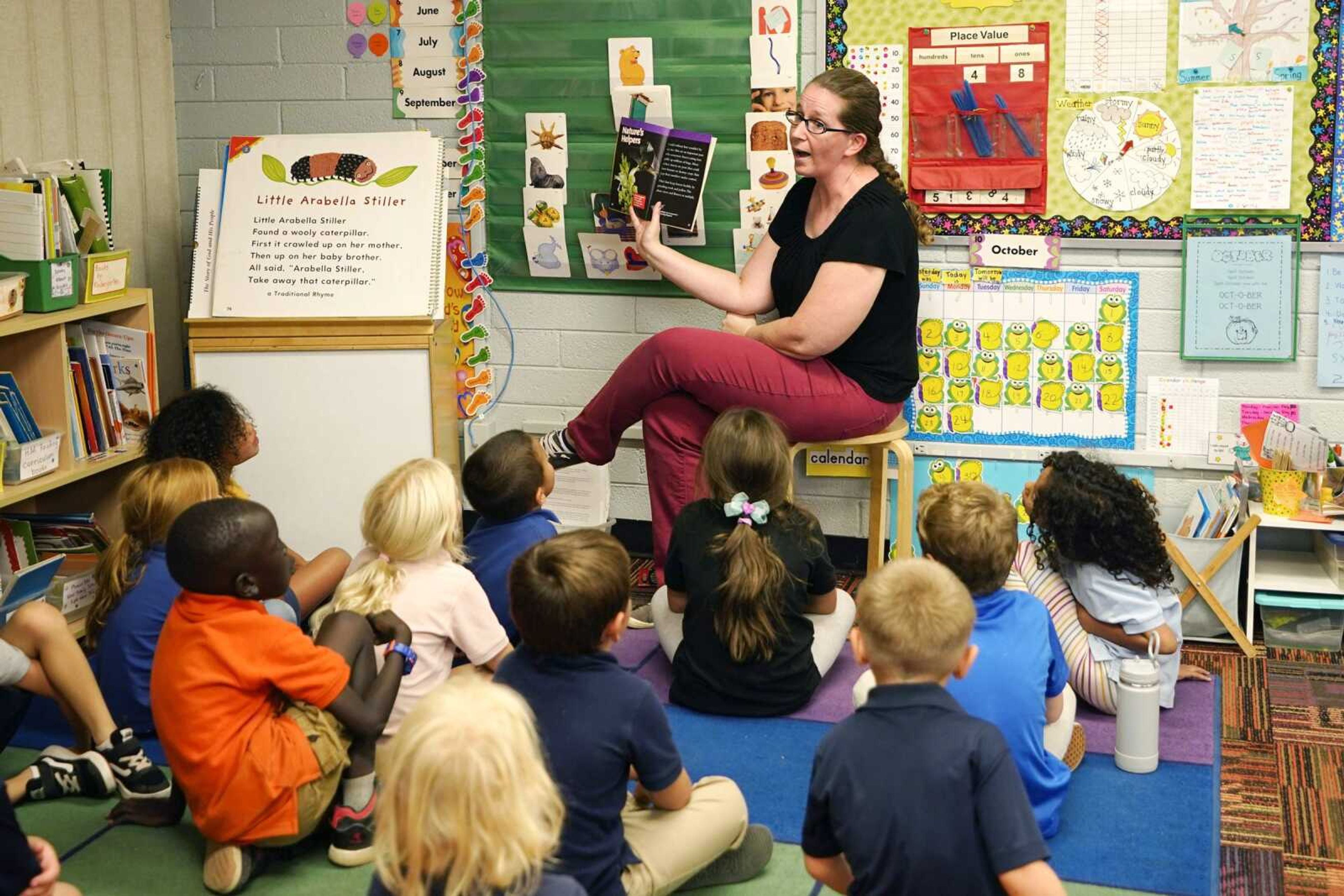 Kindergarten teacher Lynola Vis reads a book in class at Phoenix Christian School PreK-8 on Tuesday, Oct. 25, in Phoenix.