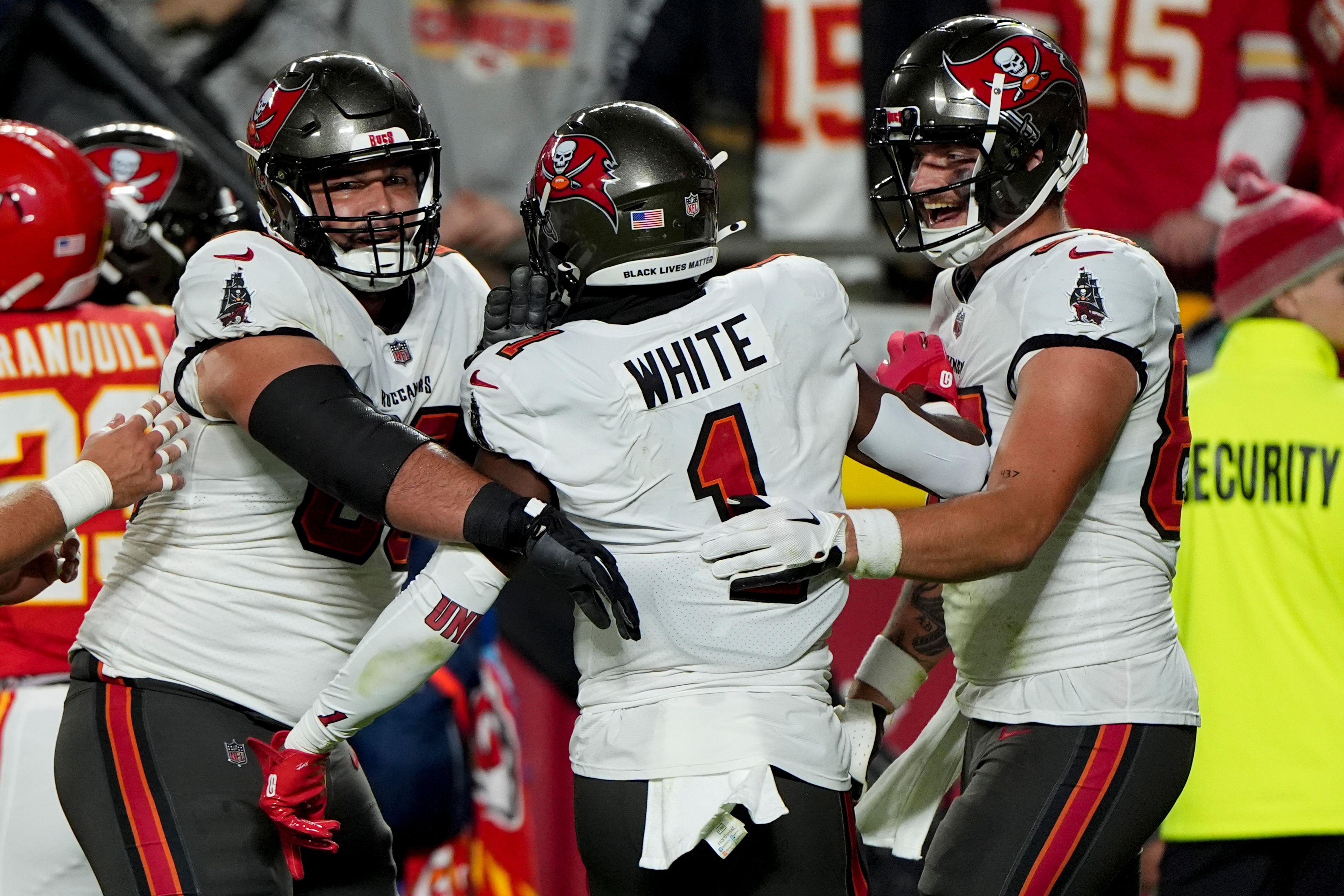 Tampa Bay Buccaneers running back Rachaad White (1) celebrates with teammates his touchdown against the Kansas City Chiefs during the first half of an NFL football game, Monday, Nov. 4, 2024, in Kansas City, Mo. (AP Photo/Charlie Riedel)